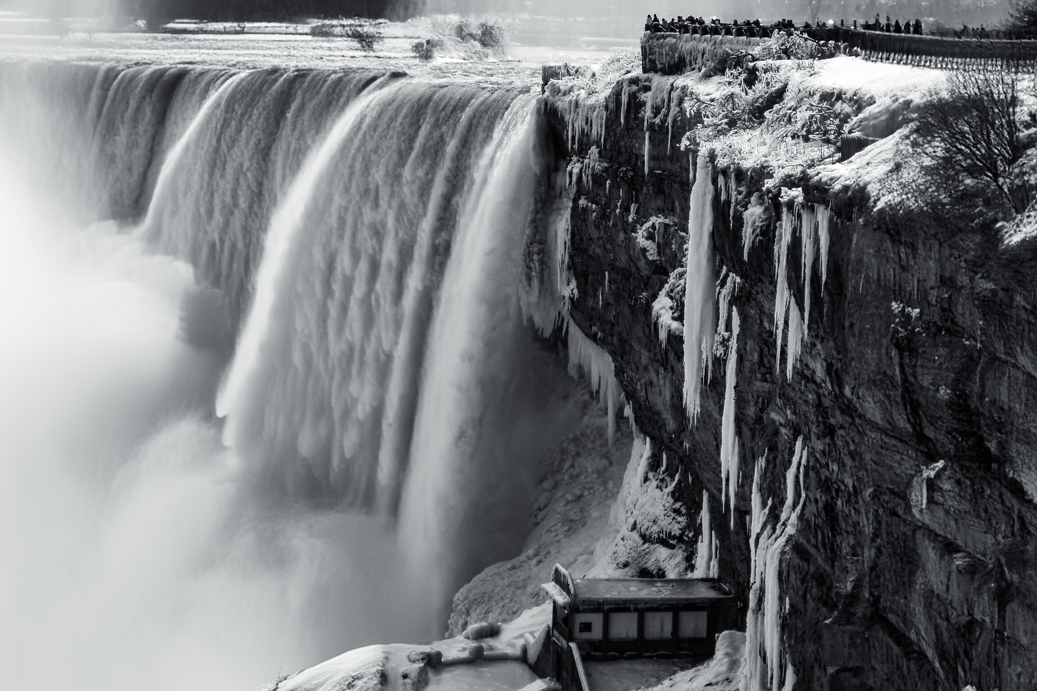 Giant icicles hang from the cliffside adjacent to the Canadian (Horseshoe) Falls at Niagara Falls in the winter of 2006.