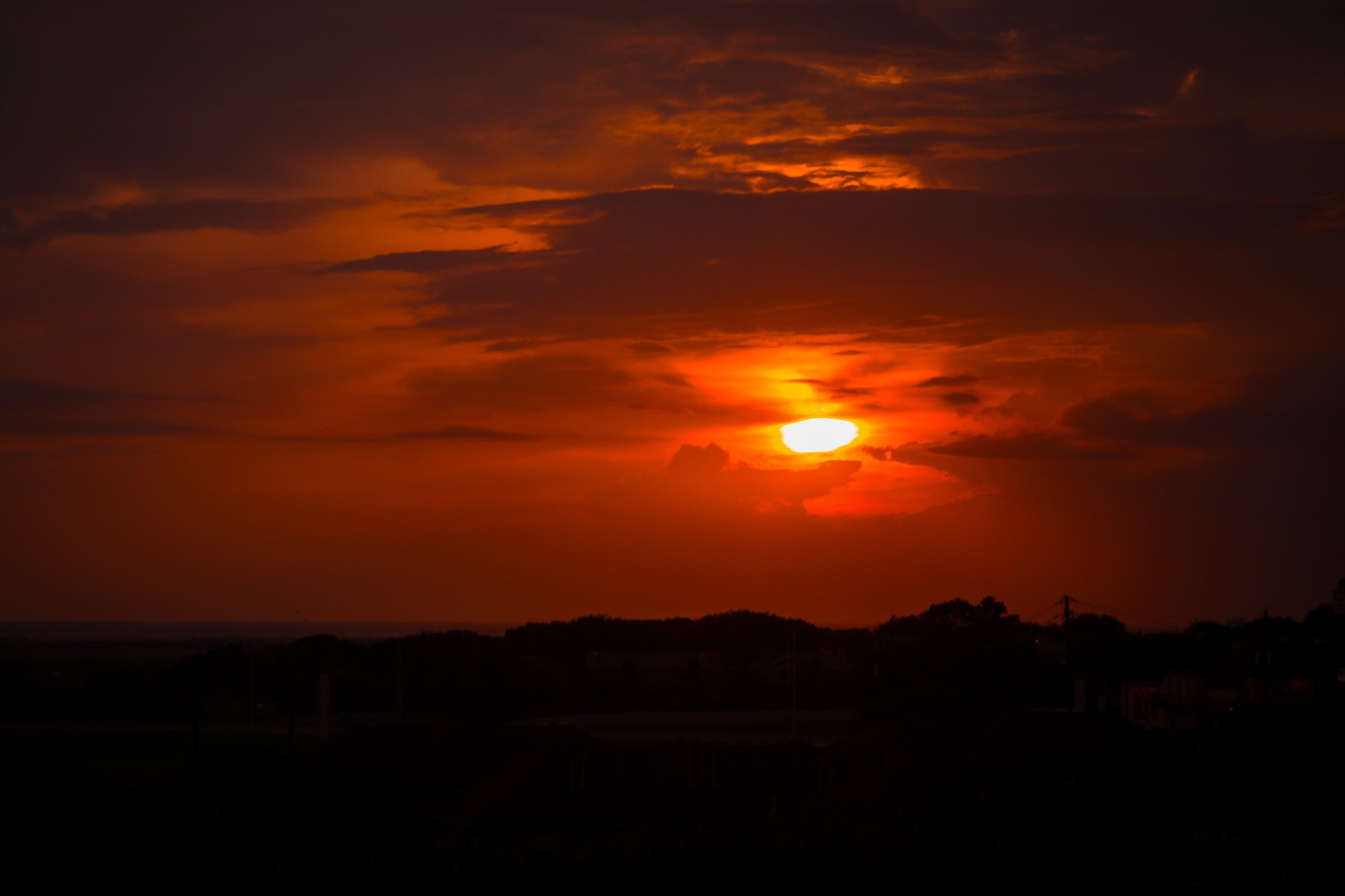 The sun begins to set on Denton County, Texas.