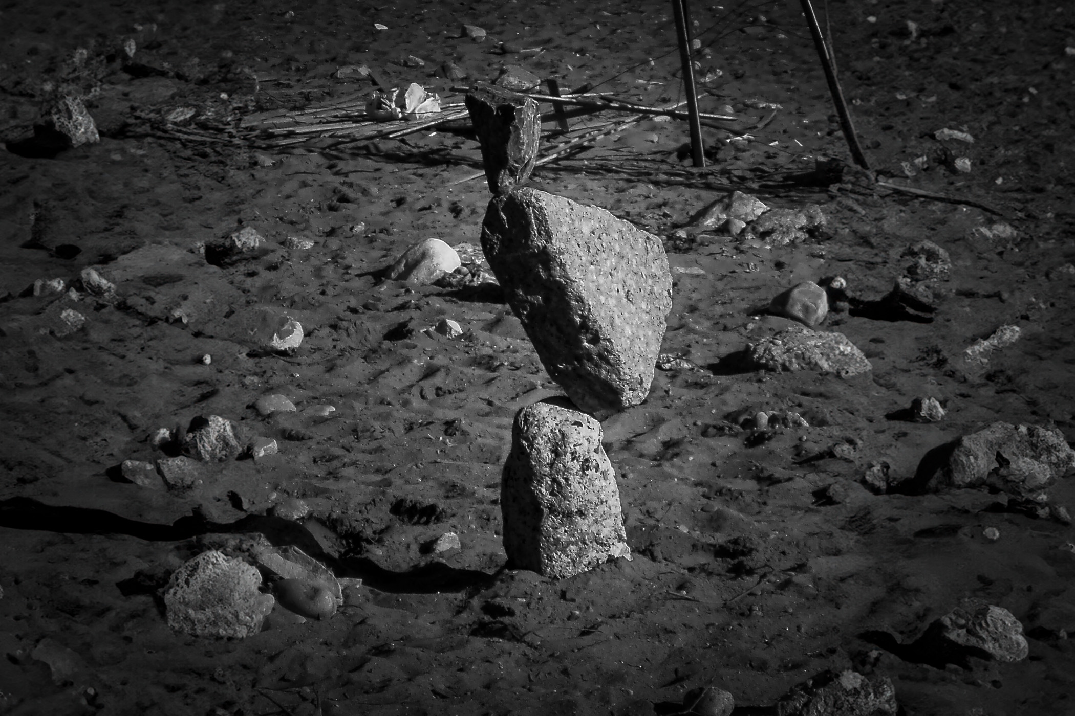 Rocks meticulously balanced in the sand at The Beaches, Toronto.