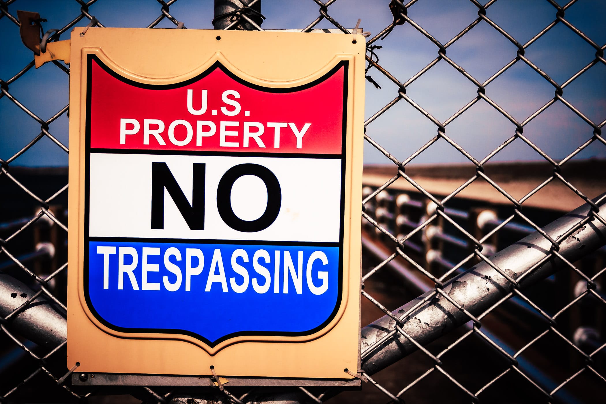 A United State Government "No Trespassing" sign at Lake Texoma Dam on the Texas-Oklahoma border.