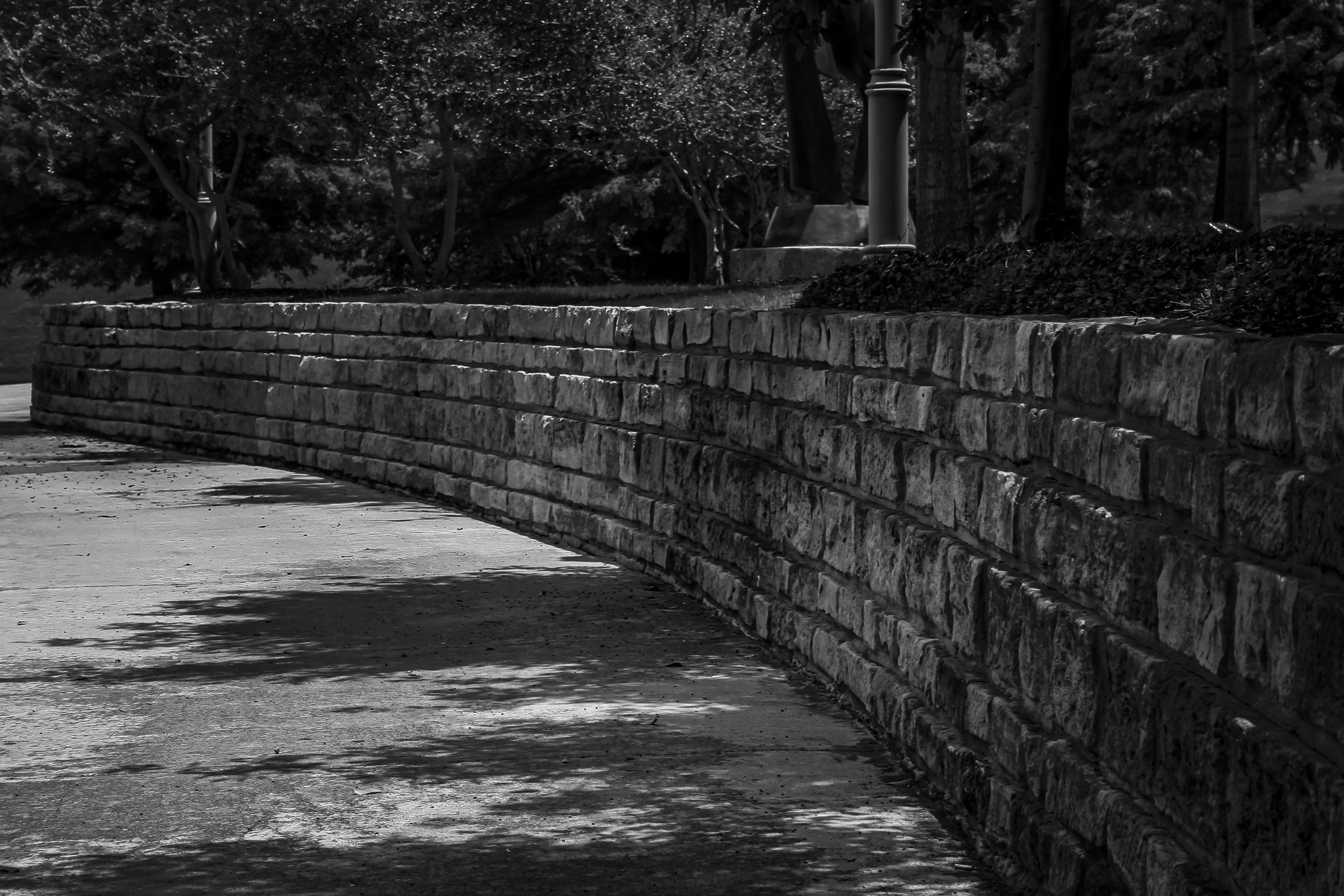 A rough-hewn stone wall at Hall Office Park in Frisco, Texas.