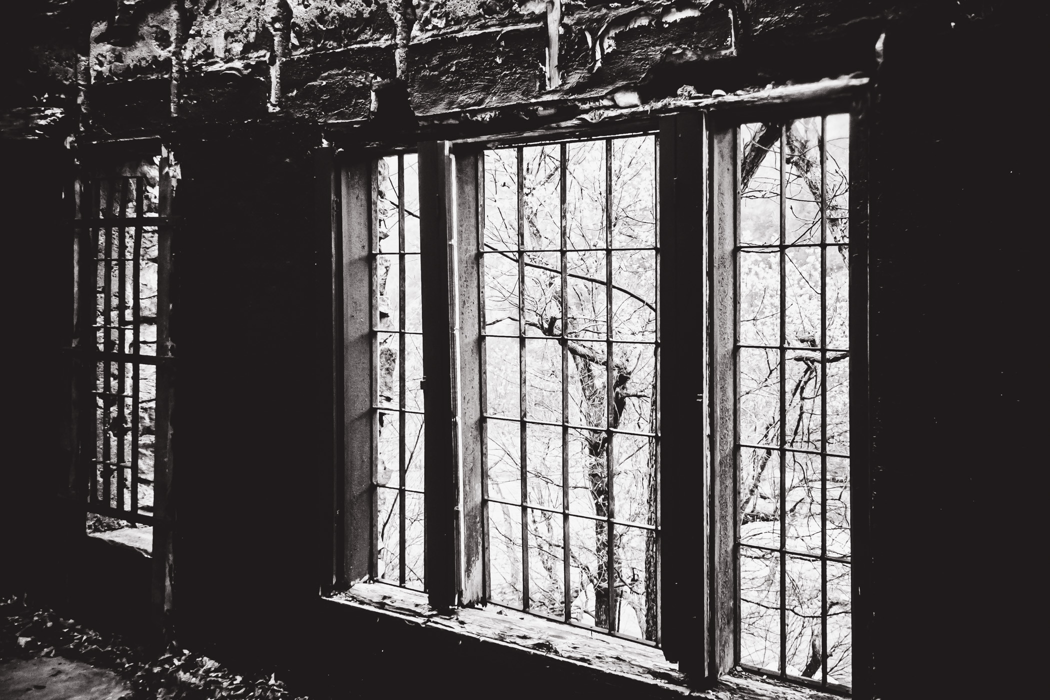 A window at an abandoned holiday cabin at Turner Falls Park, Oklahoma.