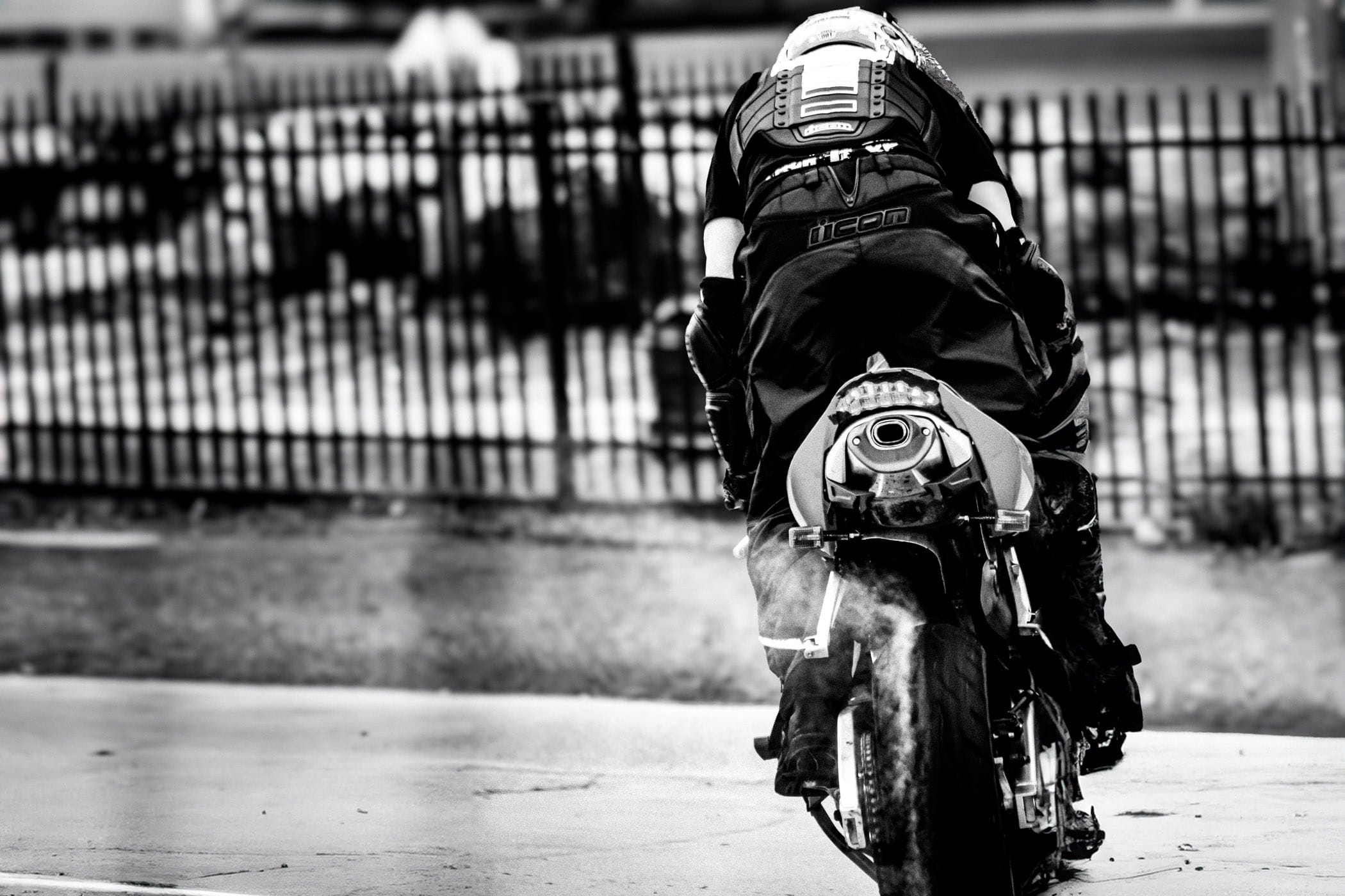 A stunt rider shows off at Honda Suzuki North in Dallas.