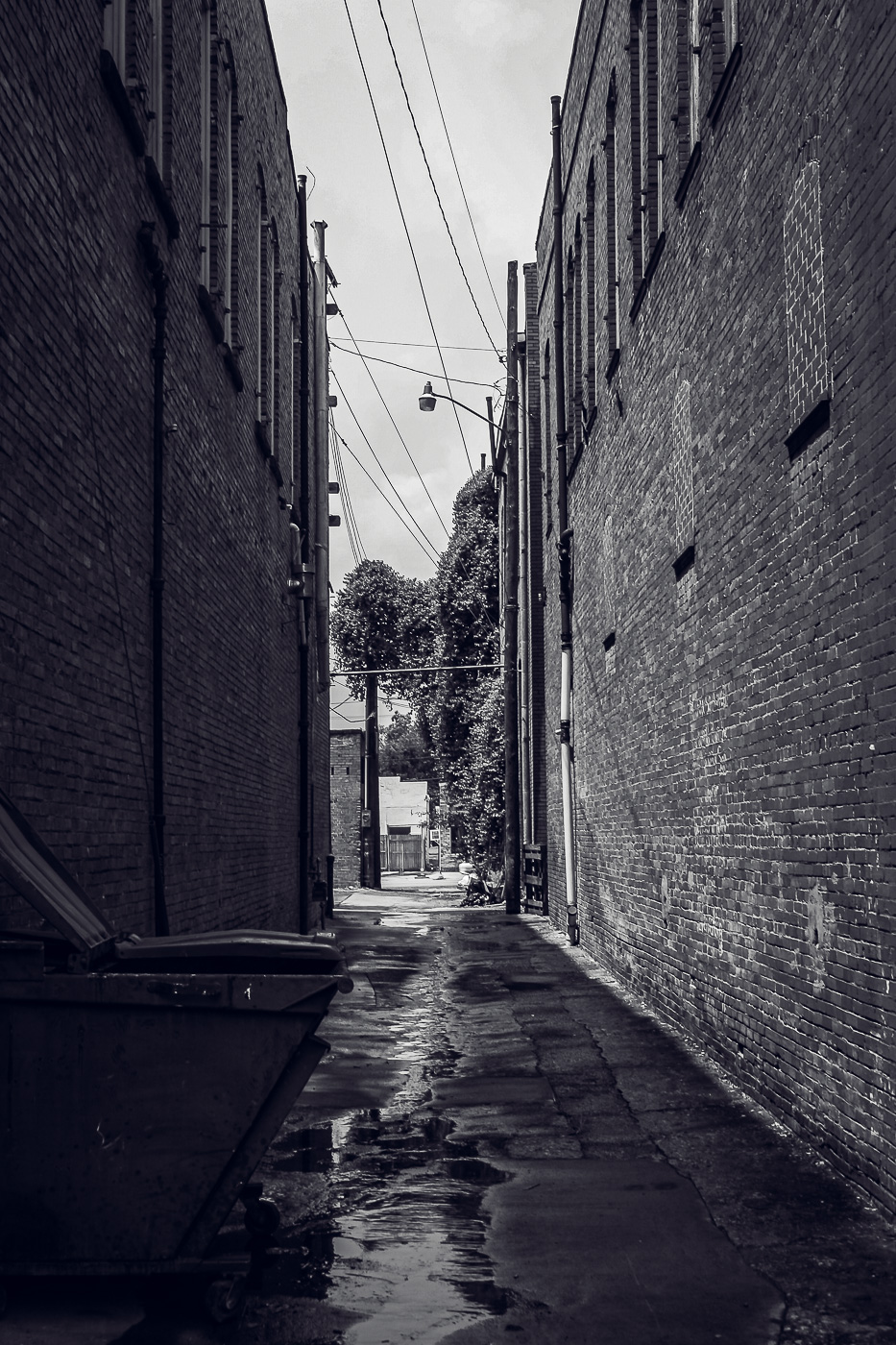 An alley leads between two buildings in Downtown Waxahachie, Texas.