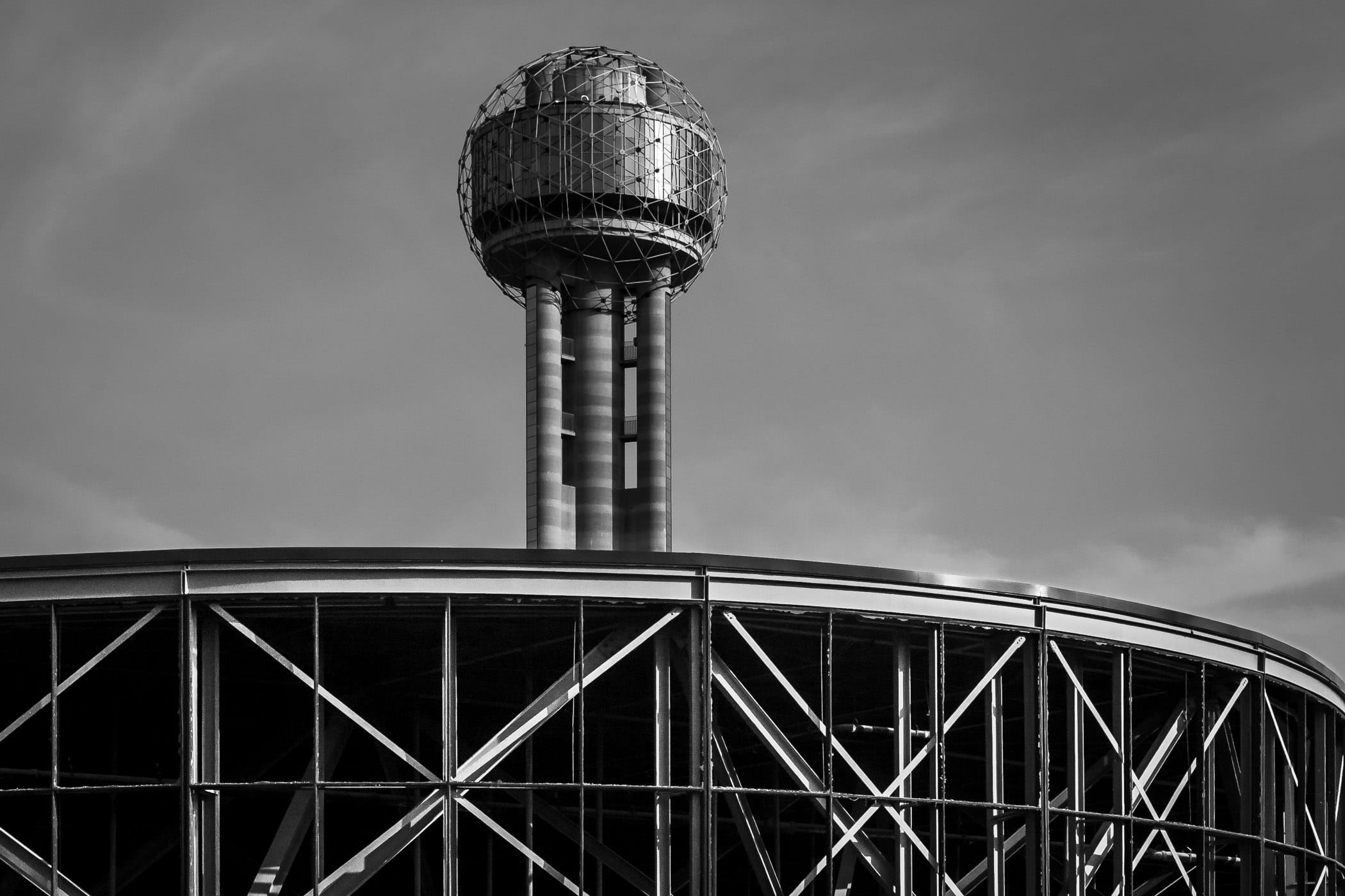 Dallas' Reunion Tower rises over the partially-demolished remains of nearby Reunion Arena.