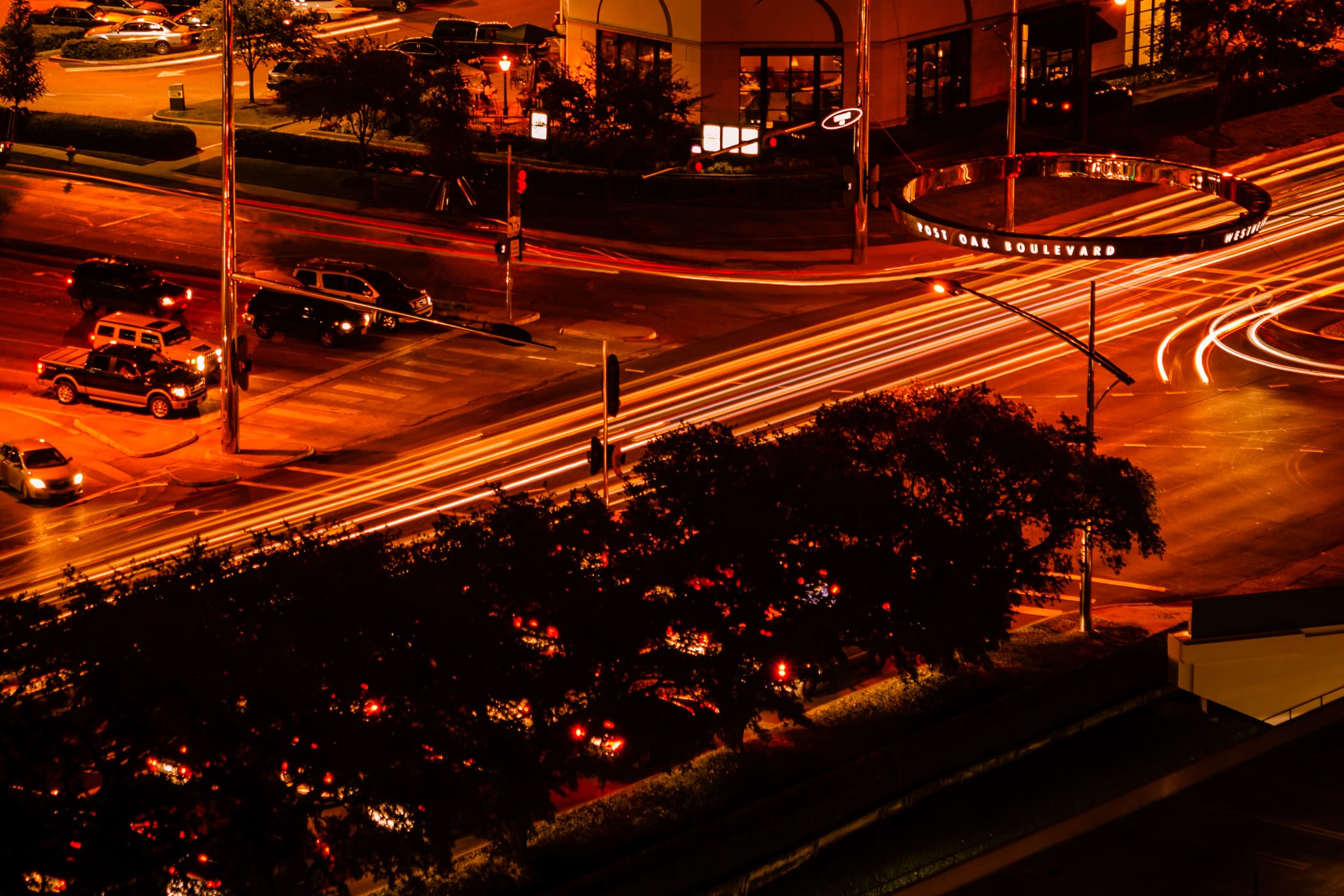 A long exposure shot of the busy Houston intersection of Post Oak and Westheimer.