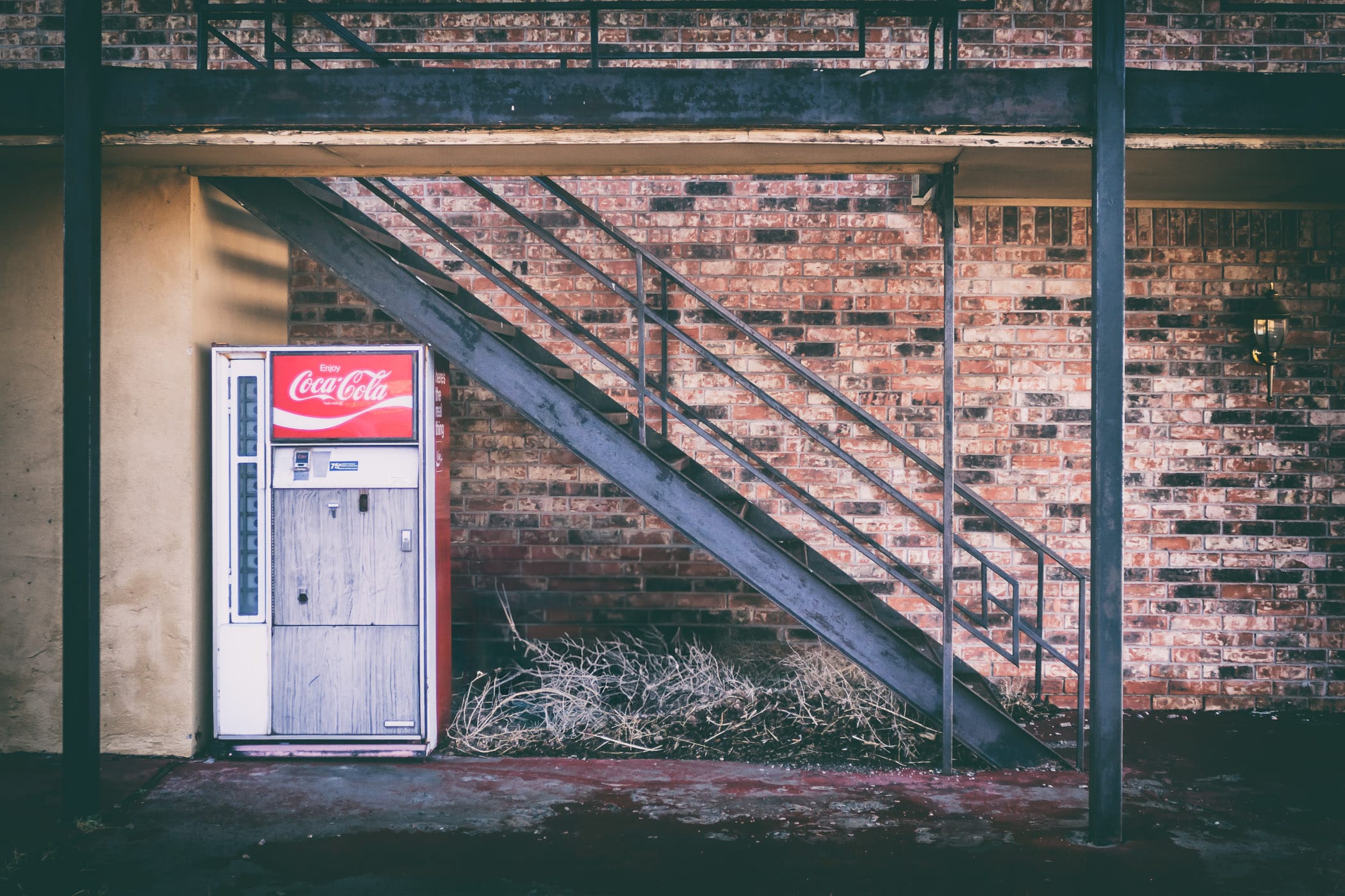 An old Coca-Cola vending machine outside a roadside motel in Adrian, Texas.