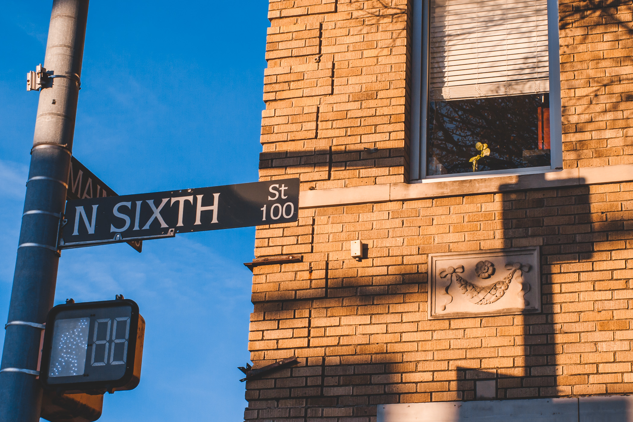 Street signs at the intersection of North Sixth Street and Main Street in Downtown Garland, Texas.