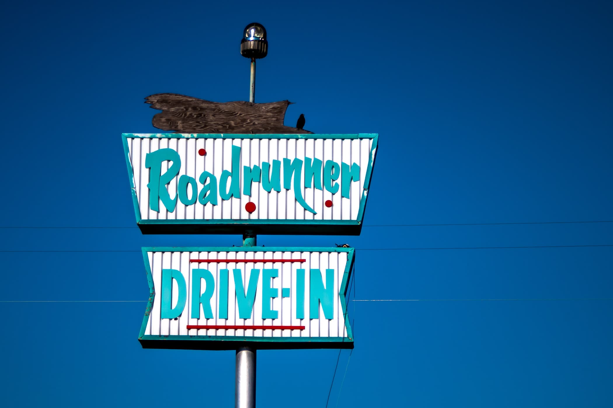 A dilapidated sign for the Roadrunner Drive-In spotted in Adrian, Texas.