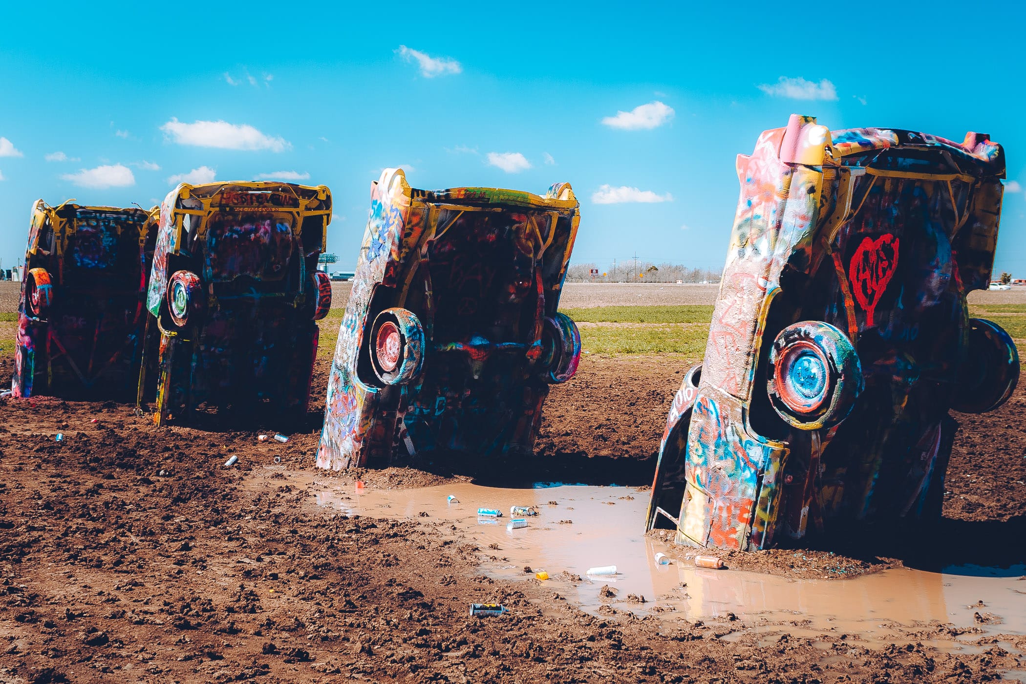 Four of the graffitied cars at Cadillac Ranch, Amarillo, Texas.