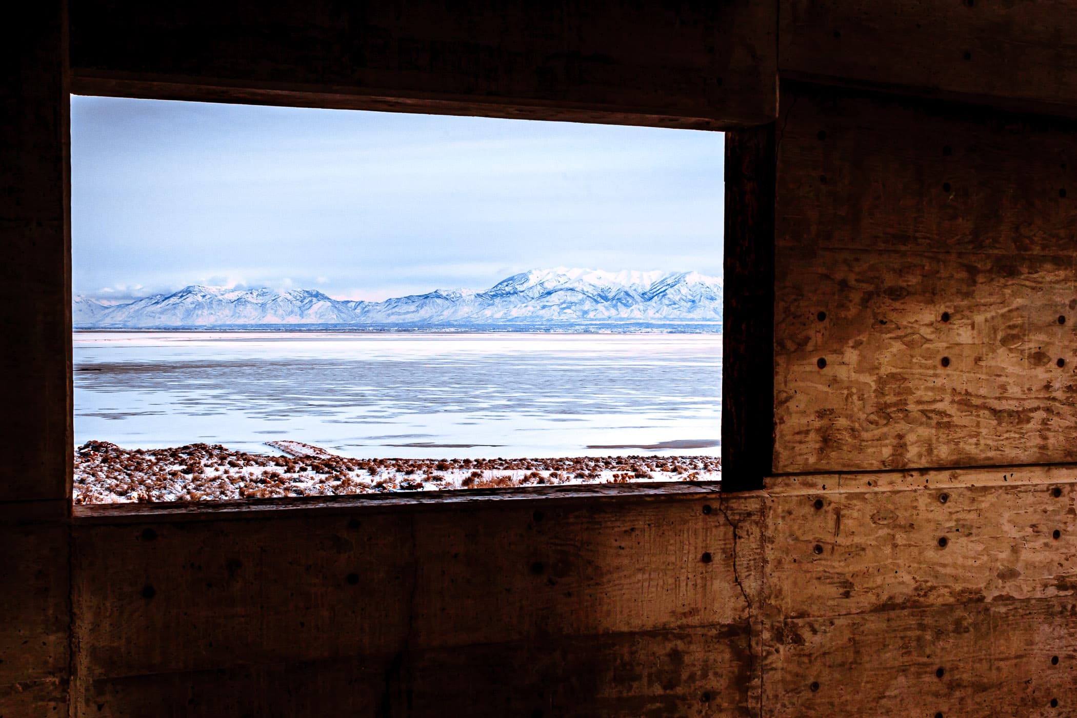 The Wasatch Front as seen through a window at the Antelope Island State Park Visitors Center, Utah.