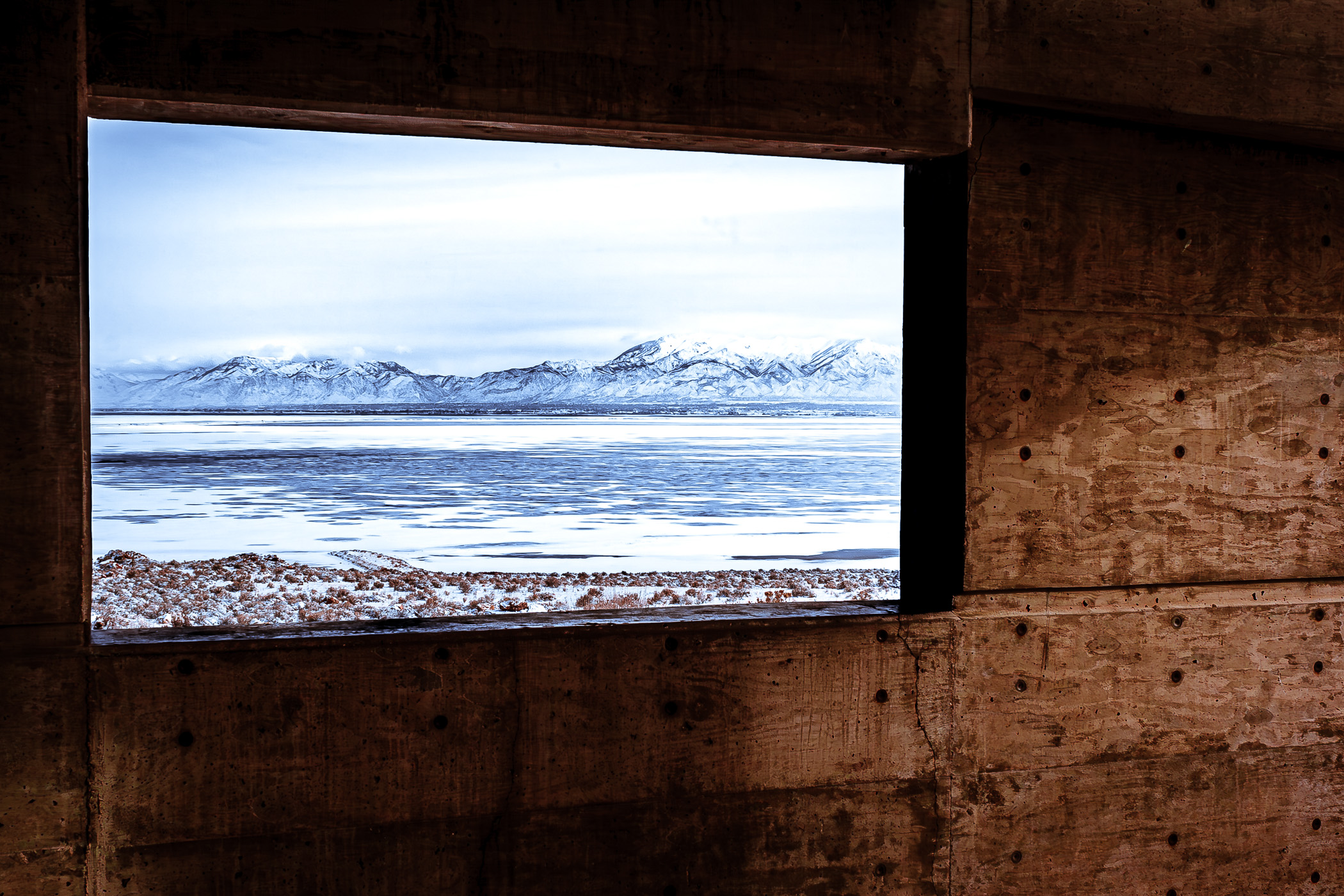 The Wasatch Front as seen through a window at the Antelope Island State Park Visitors Center, Utah.