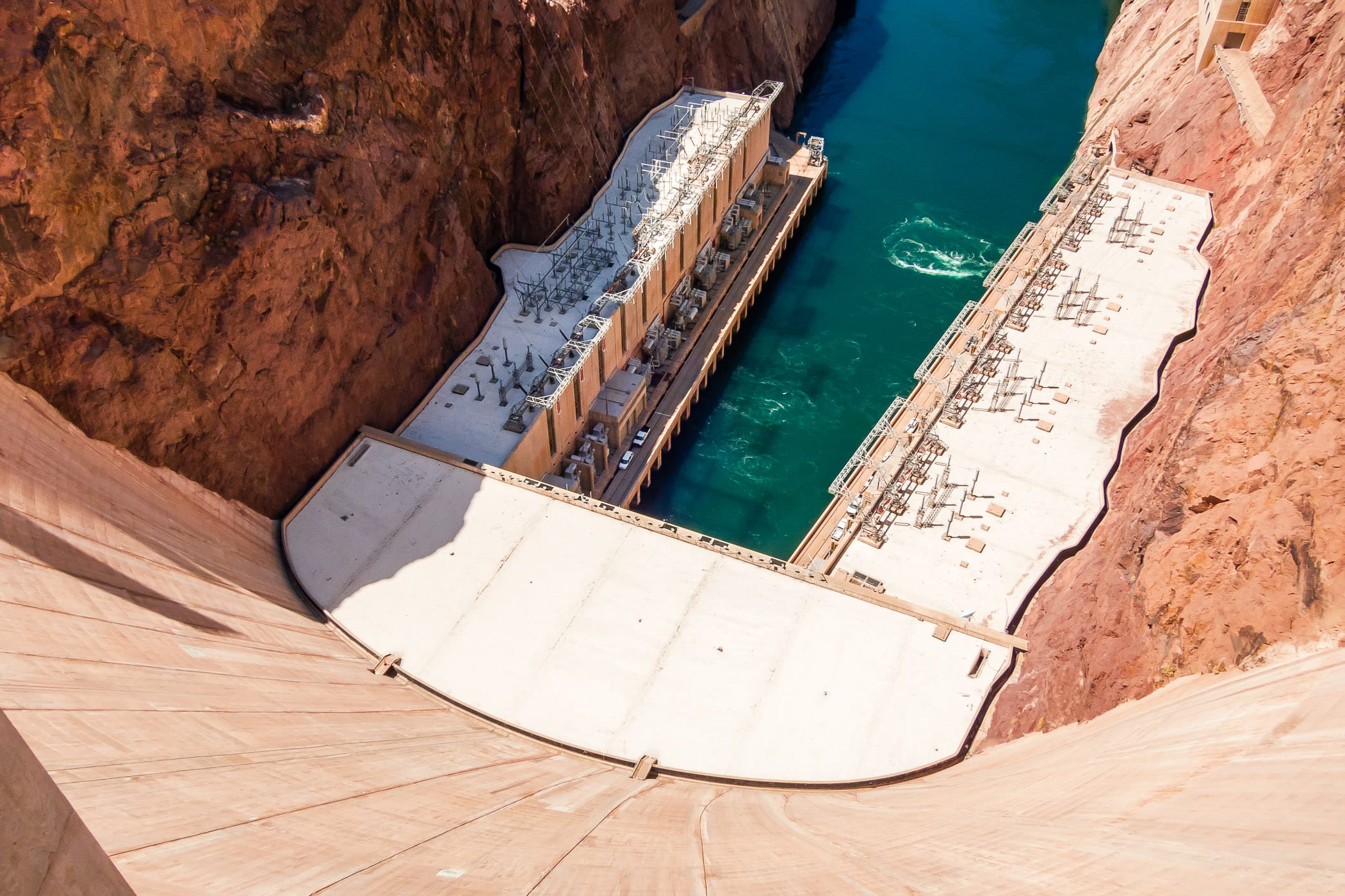 Looking down the 221 meter (726 ft.) tall Hoover Dam on the Colorado River at the border of Nevada and Arizona.