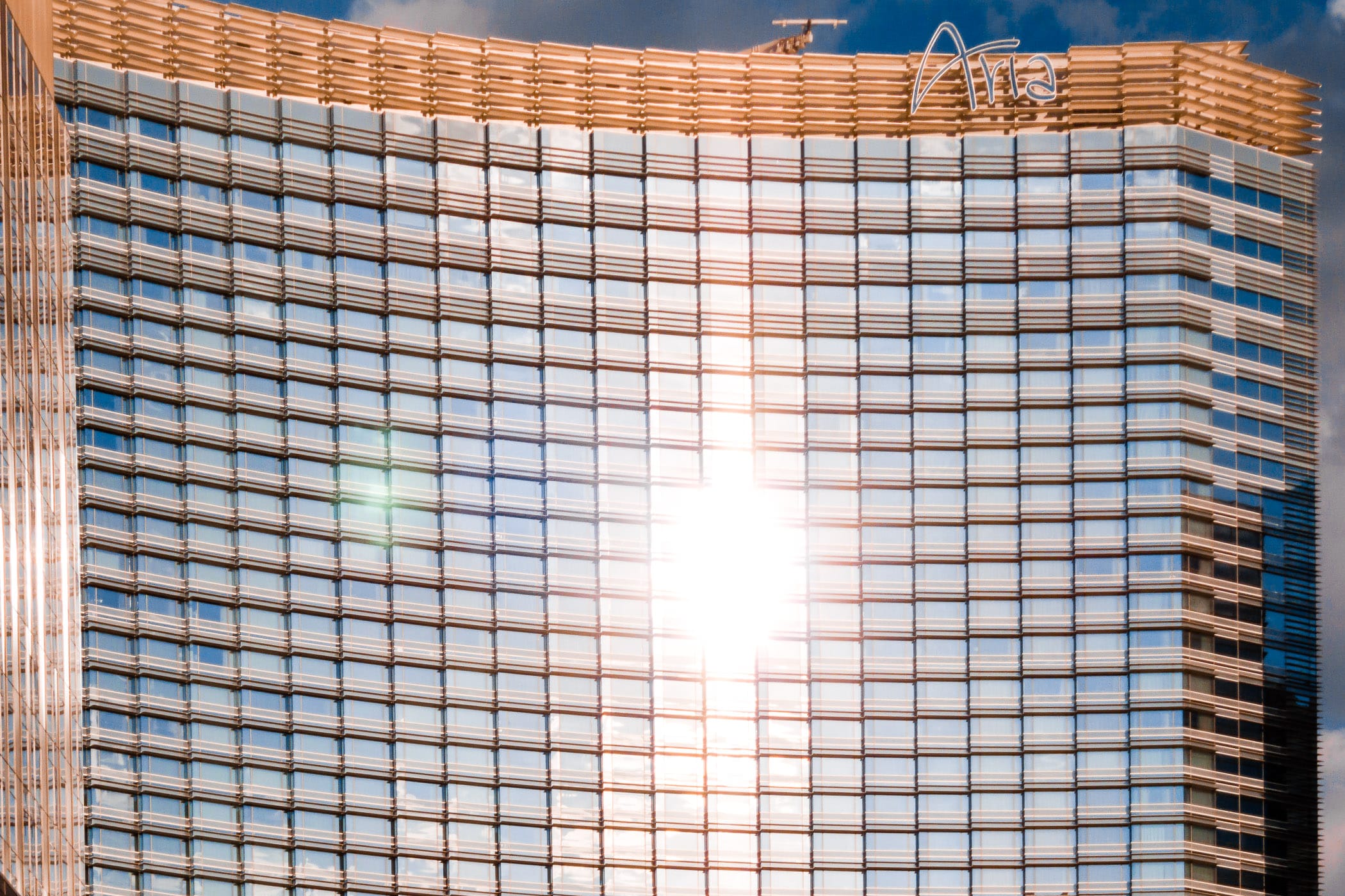 The sun glints off the windowed facade of the Aria, CityCenter, Las Vegas.