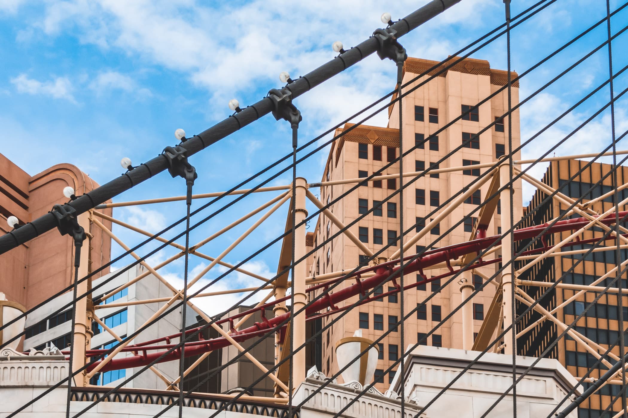 The faux Brooklyn Bridge stands in front of Las Vegas' New York-New York Hotel and Casino and the tracks of its roller coaster.