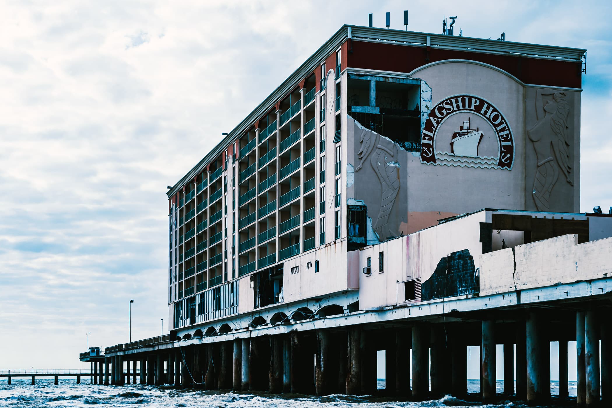 The Flagship Hotel, built on a pier extending from Galveston's Seawall Boulevard out into the Gulf of Mexico, sits damaged and abandoned in the aftermath of Hurricane Ike.