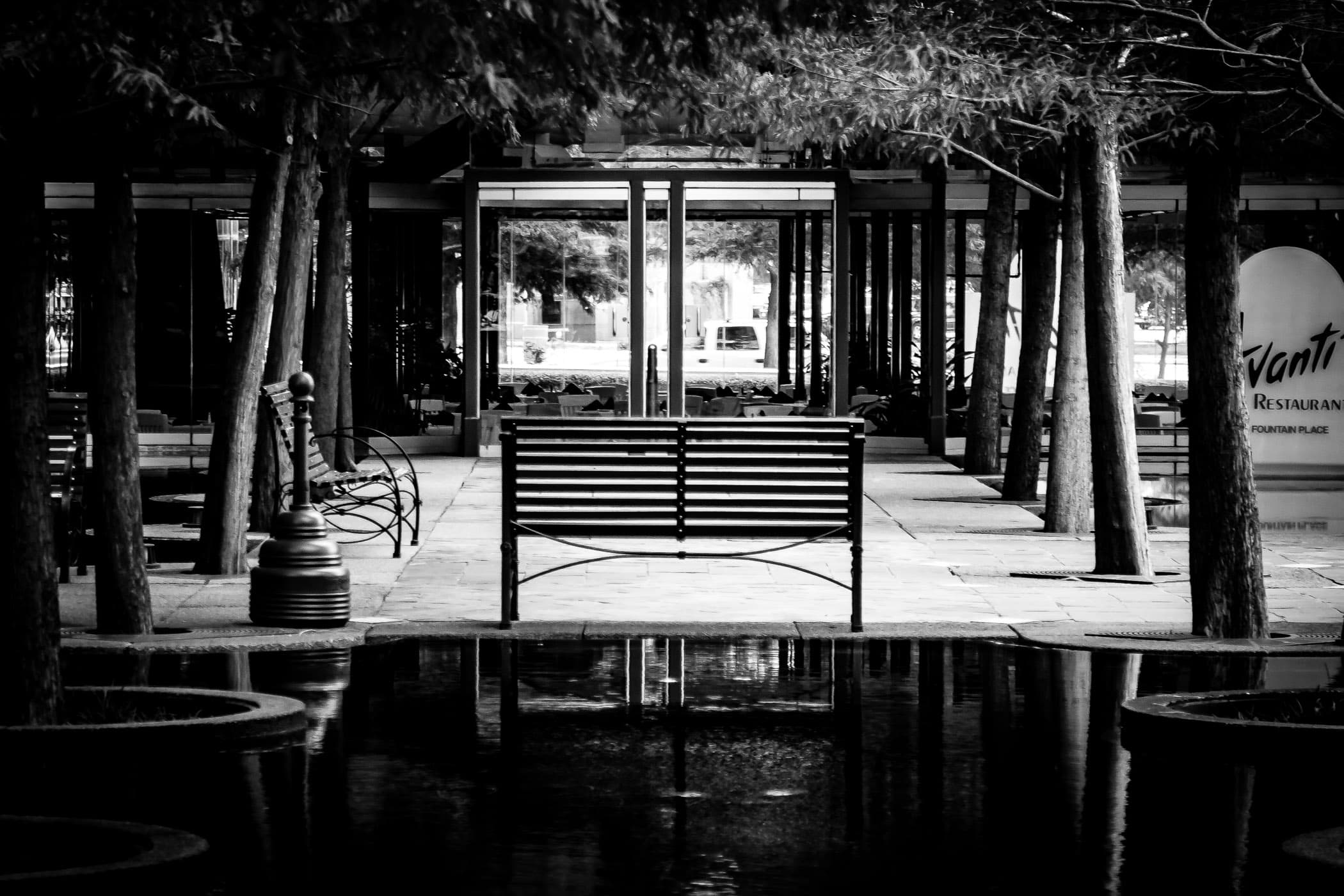 A bench in a water garden at Dallas' Fountain Place.