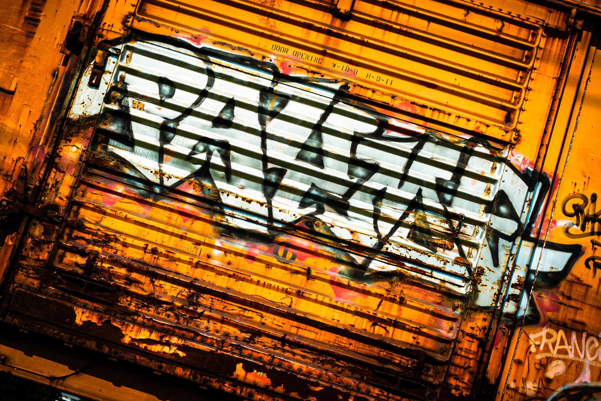 Graffiti on a railroad box car in Farmers Branch, Texas.