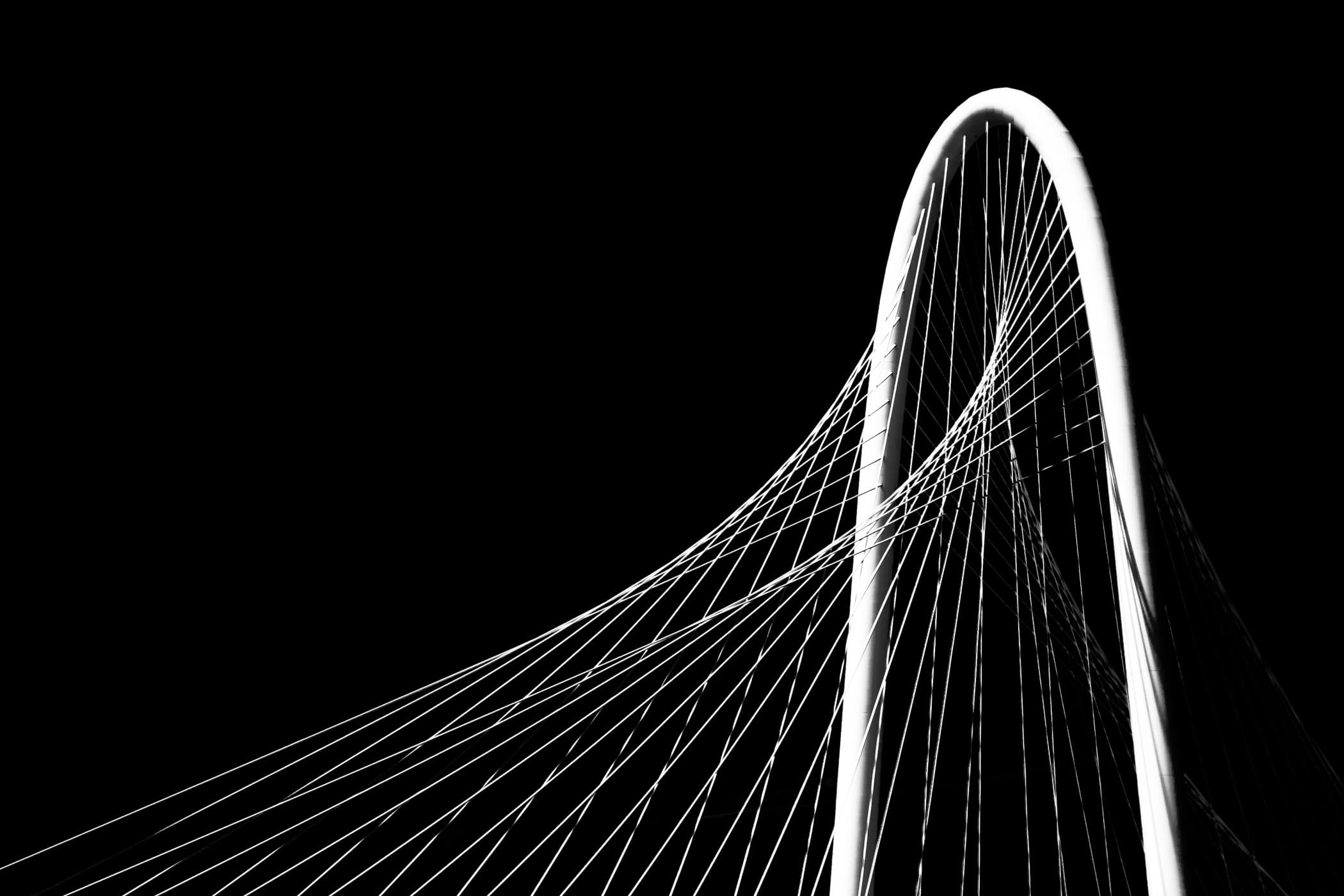 Detail of the main arch and suspension cables of Santiago Calatrava's Margaret Hunt Hill Bridge, Dallas, Texas.