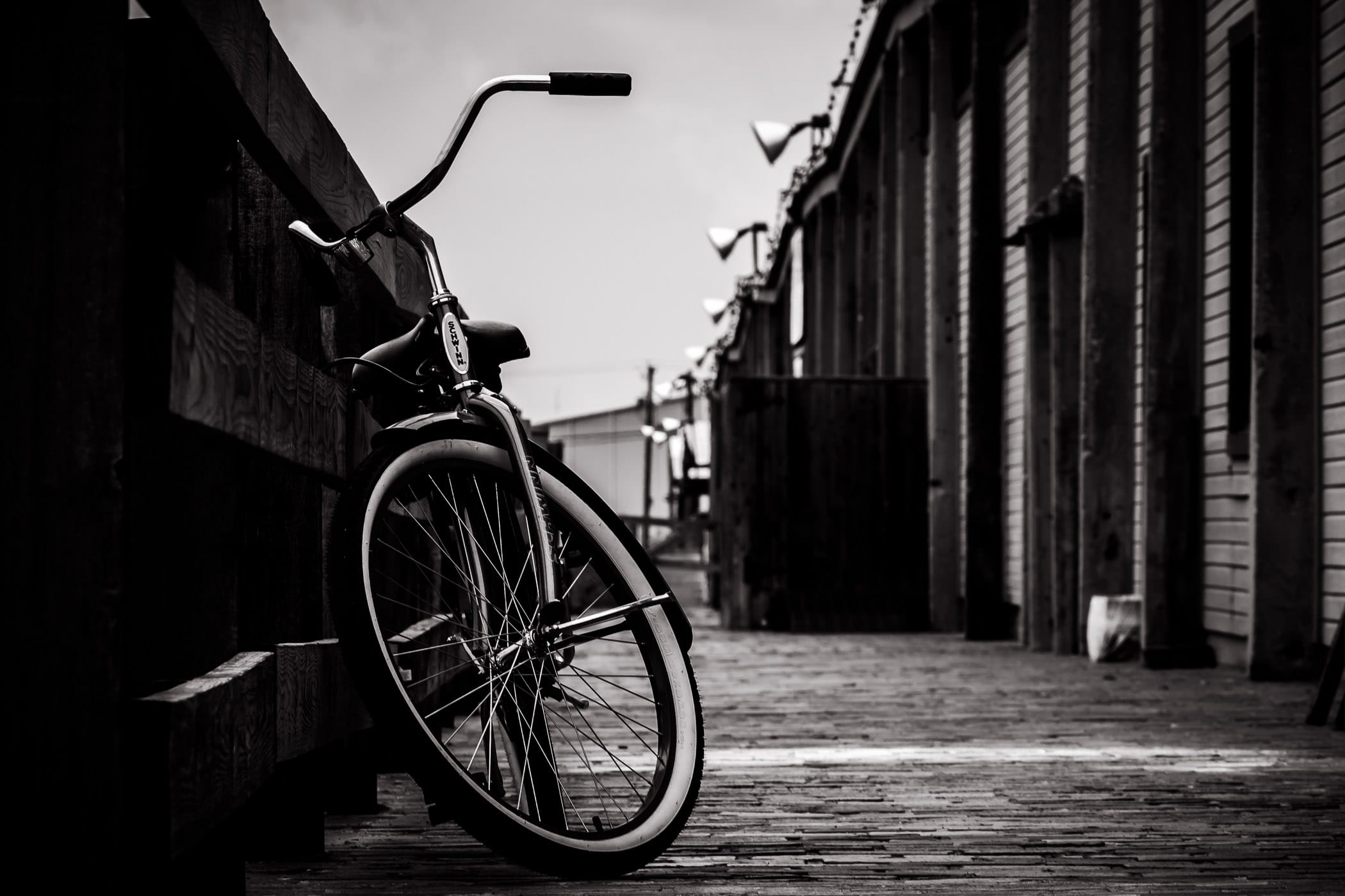 A lonely bicycle leans against a railing in the Fort Worth Stockyards.