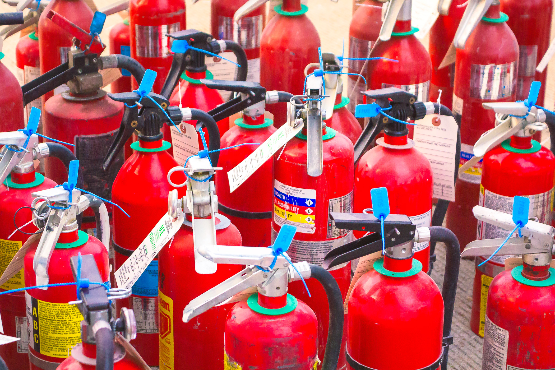 Fire extinguishers ready for strategic distribution around Addison Circle Park in Addison, Texas, for Oktoberfest safety.