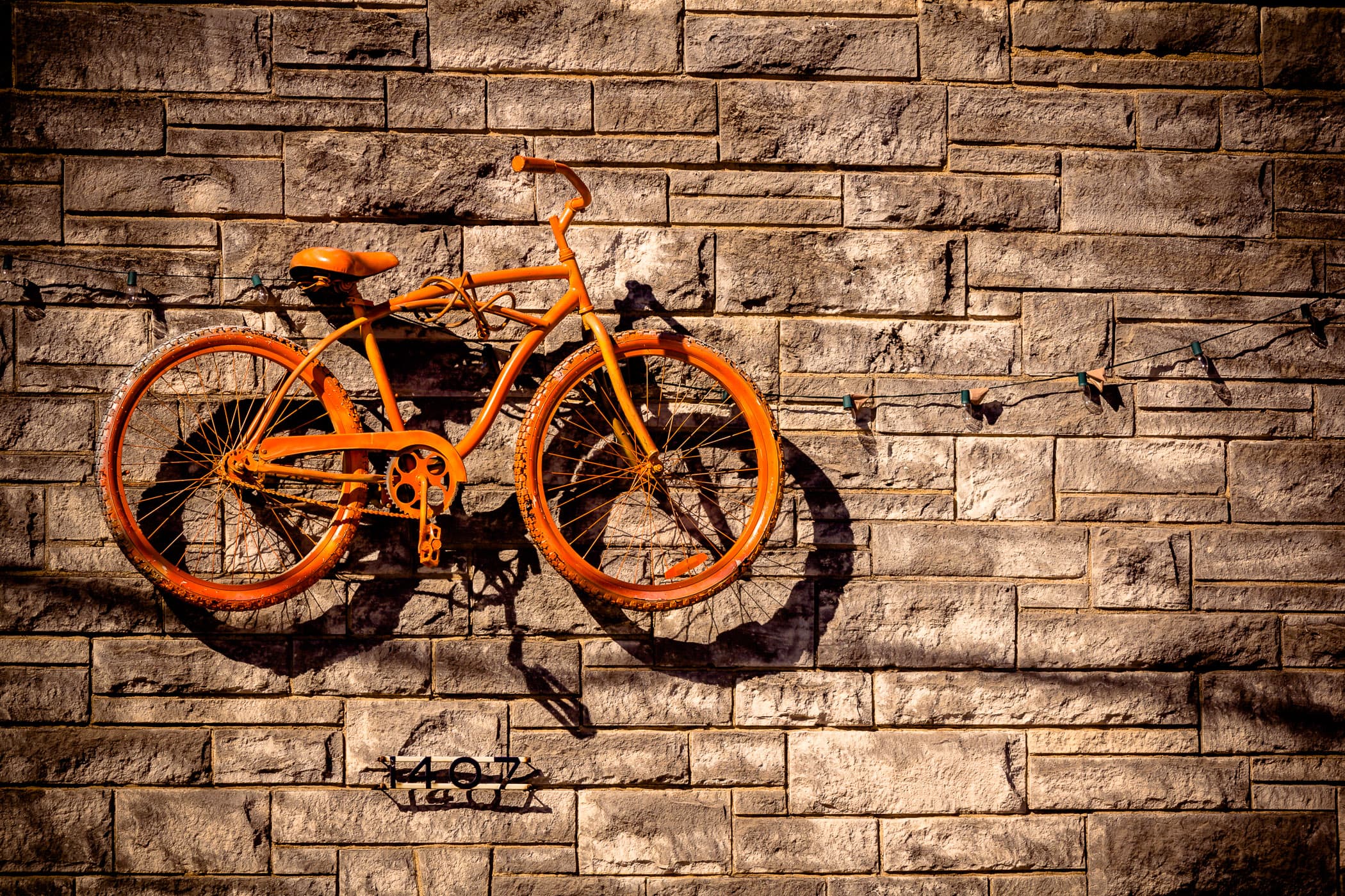 A bicycle as artwork on the side of a custom bike shop in The Cedars, Dallas, Texas.