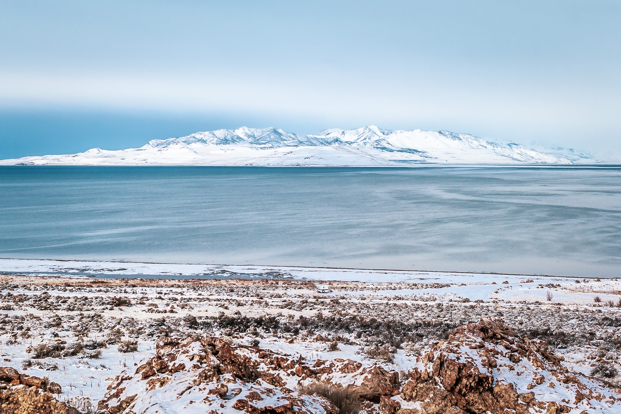 A mountain rises from the Great Salt Lake, Utah, as seen from Antelope Island.