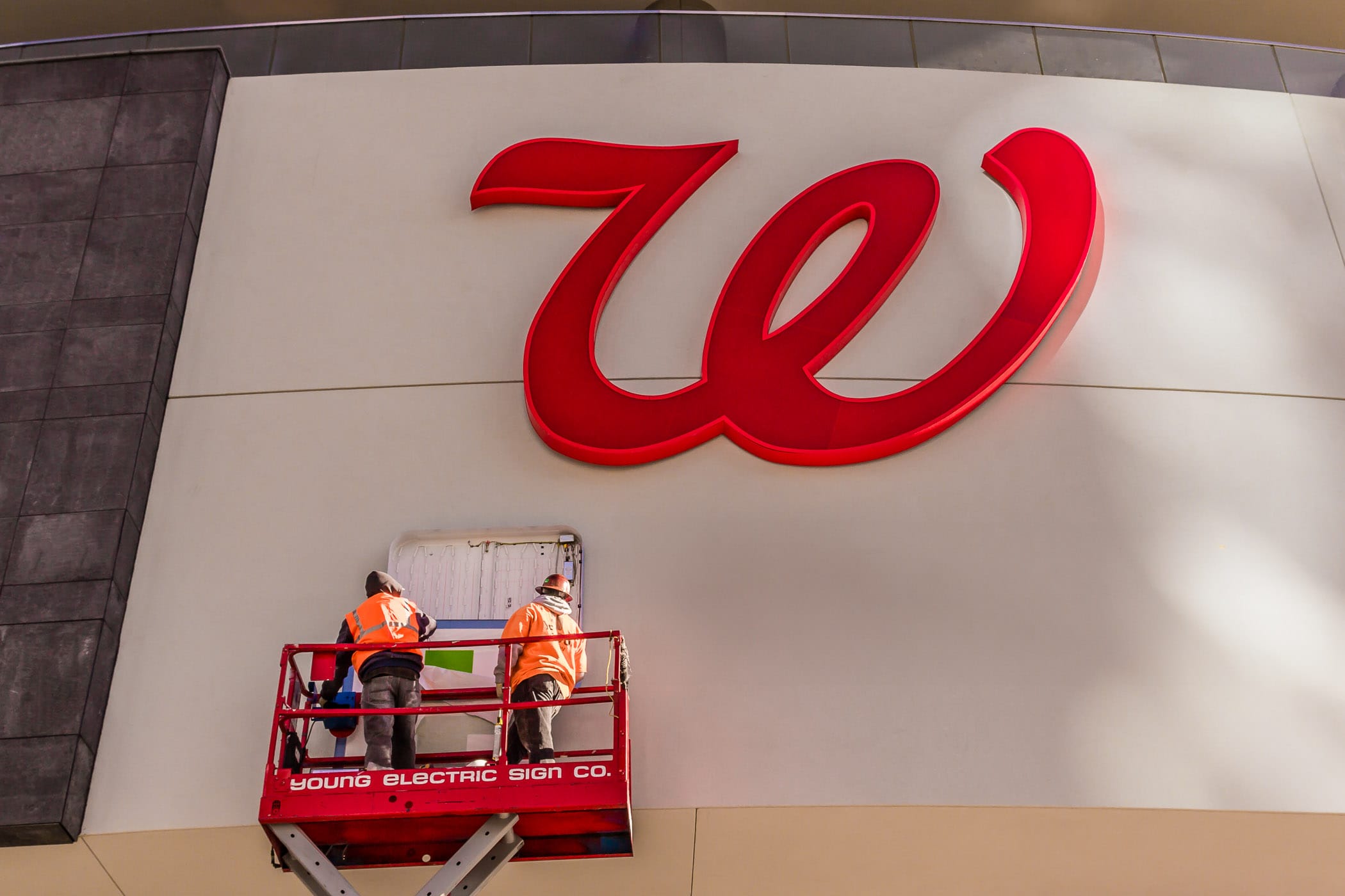 Employees of the Young Electric Sign Company—creators of most of Las Vegas' iconic signs—install signage at a new Walgreens on The Strip, adjacent to Planet Hollywood.