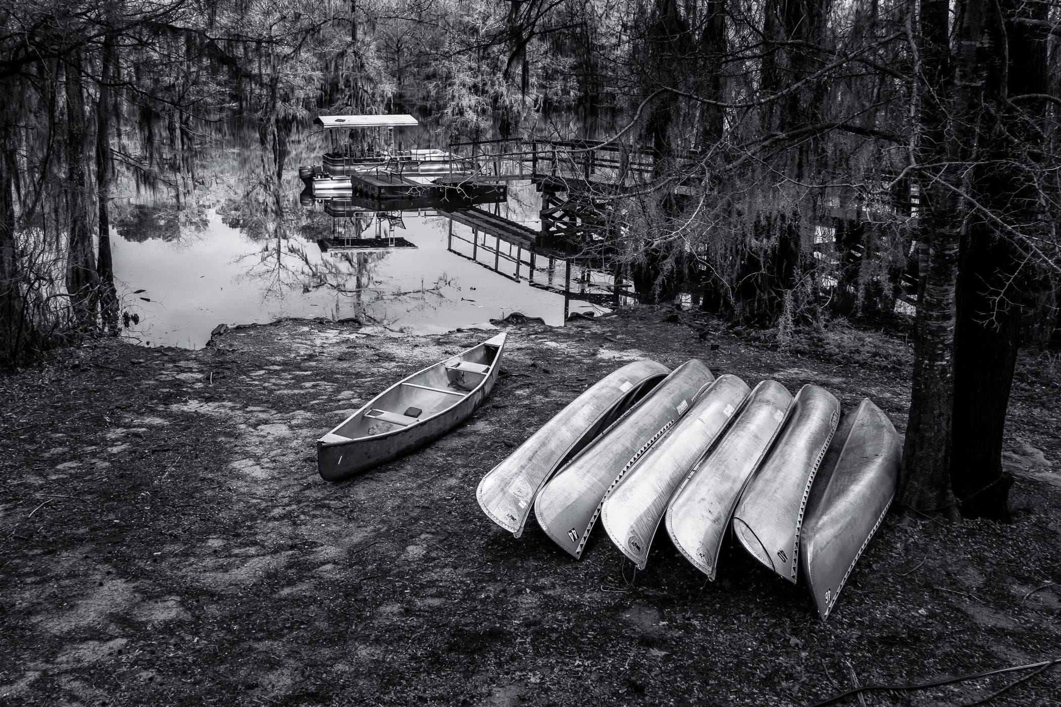 Canoes ashore at Caddo Lake State Park, Texas.