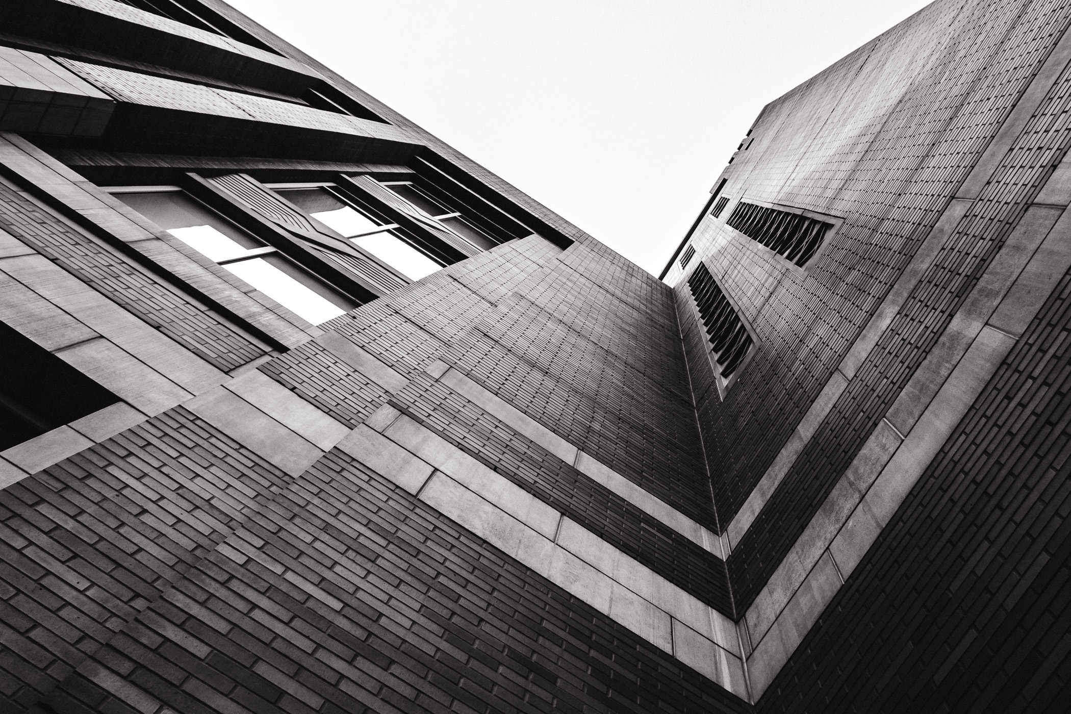 Looking skyward along the brick façade of Dallas' American Airlines Center.