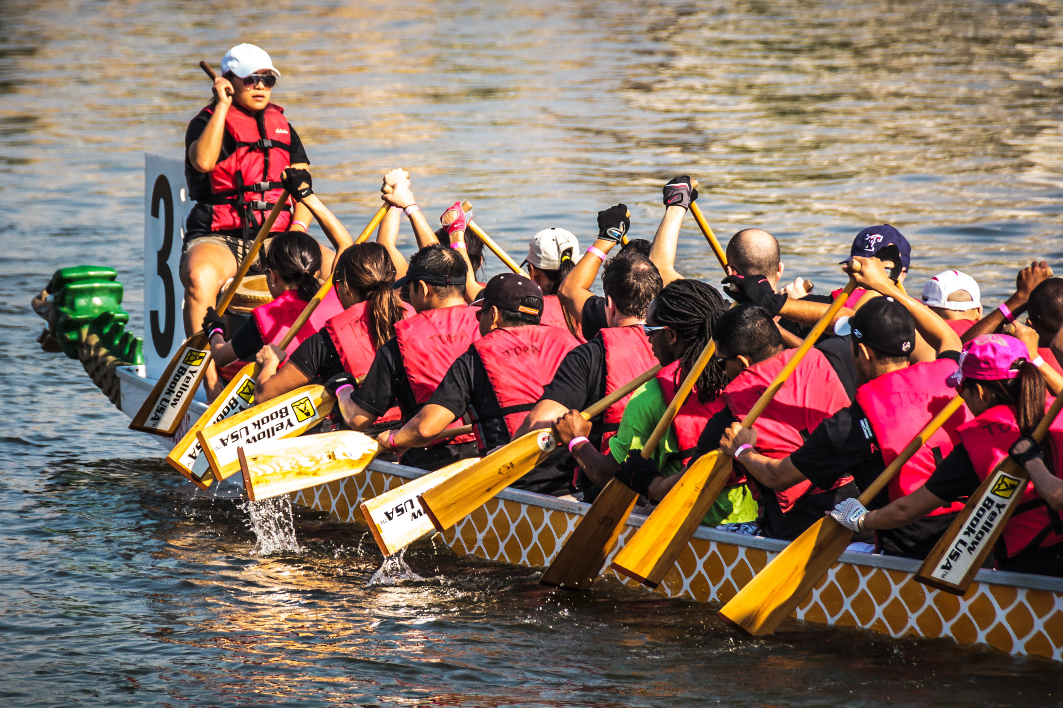 Racers rowing at the 2012 DFW Dragon Boat Festival, Lake Carolyn, Las Colinas, Irving, Texas.