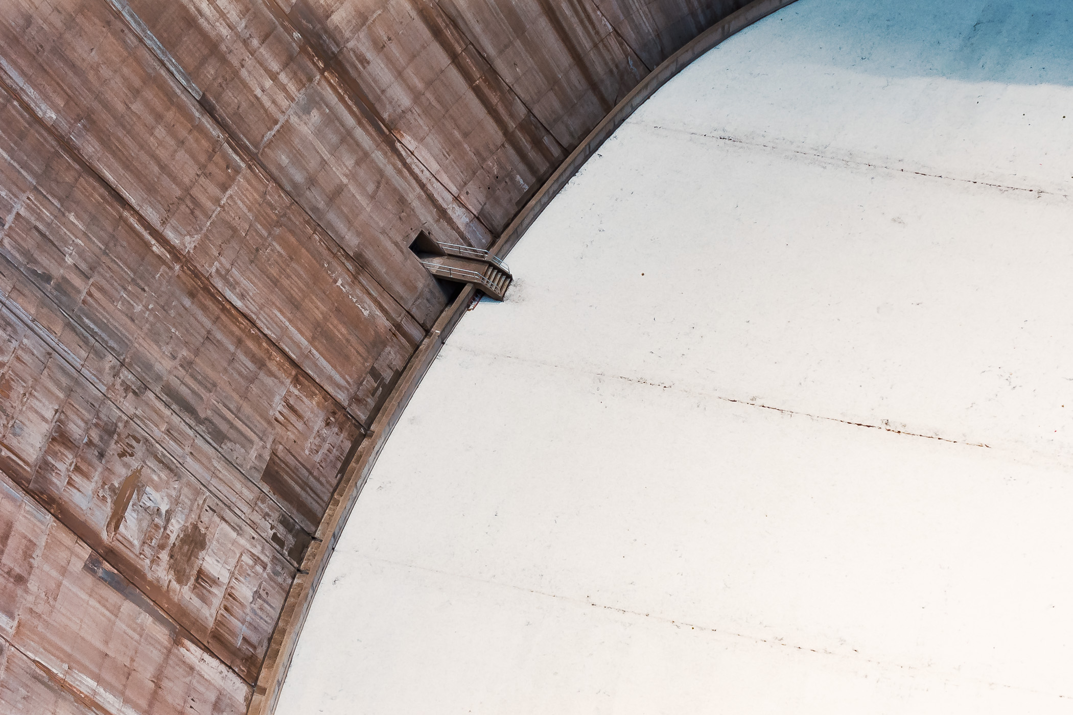 Stairs lead to a maintenance door at the base of Hoover Dam's 726-foot-tall face, on the Nevada-Arizona Border.