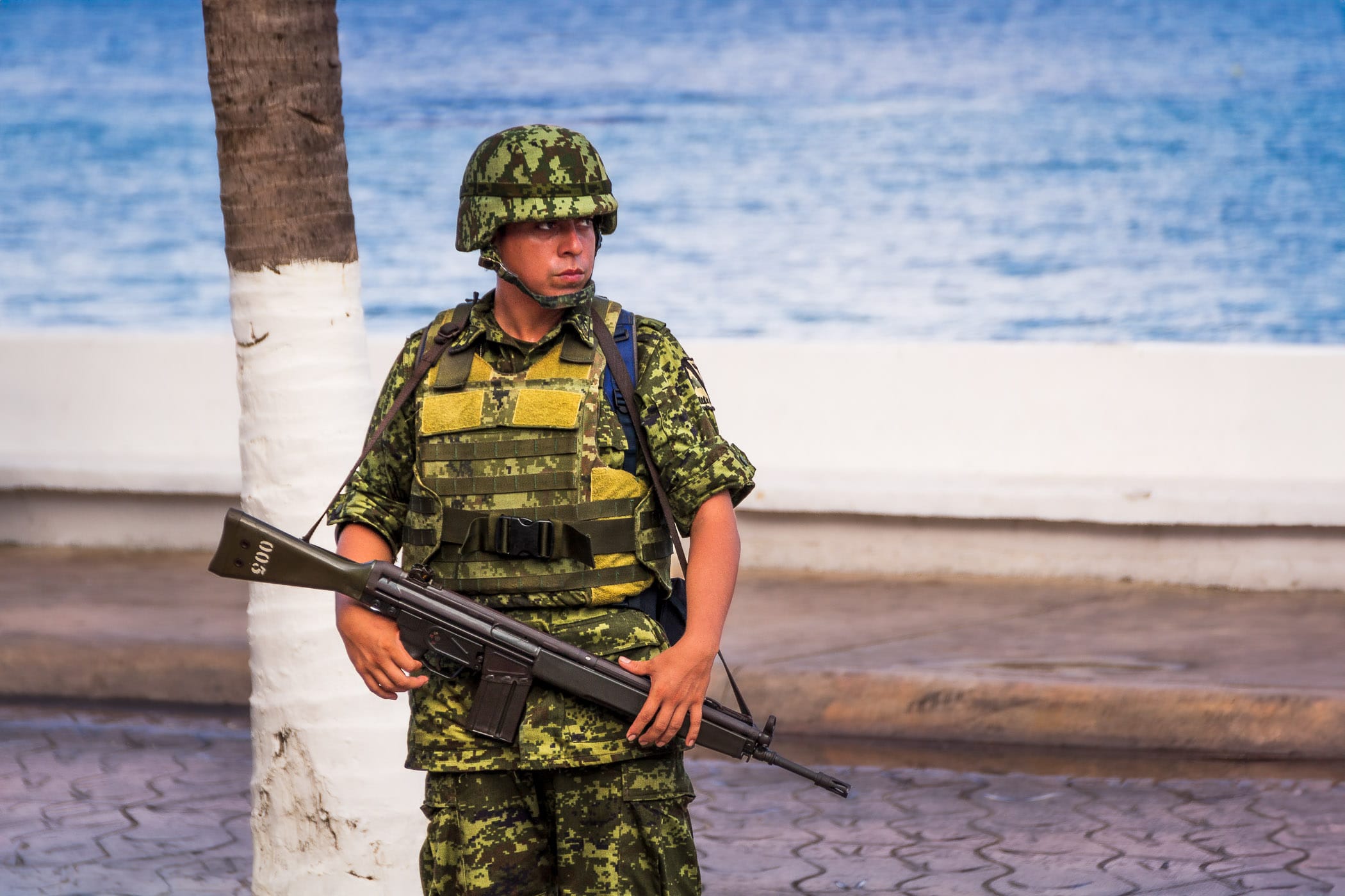 A soldier keeps watch in San Miguel, Cozumel, Mexico.