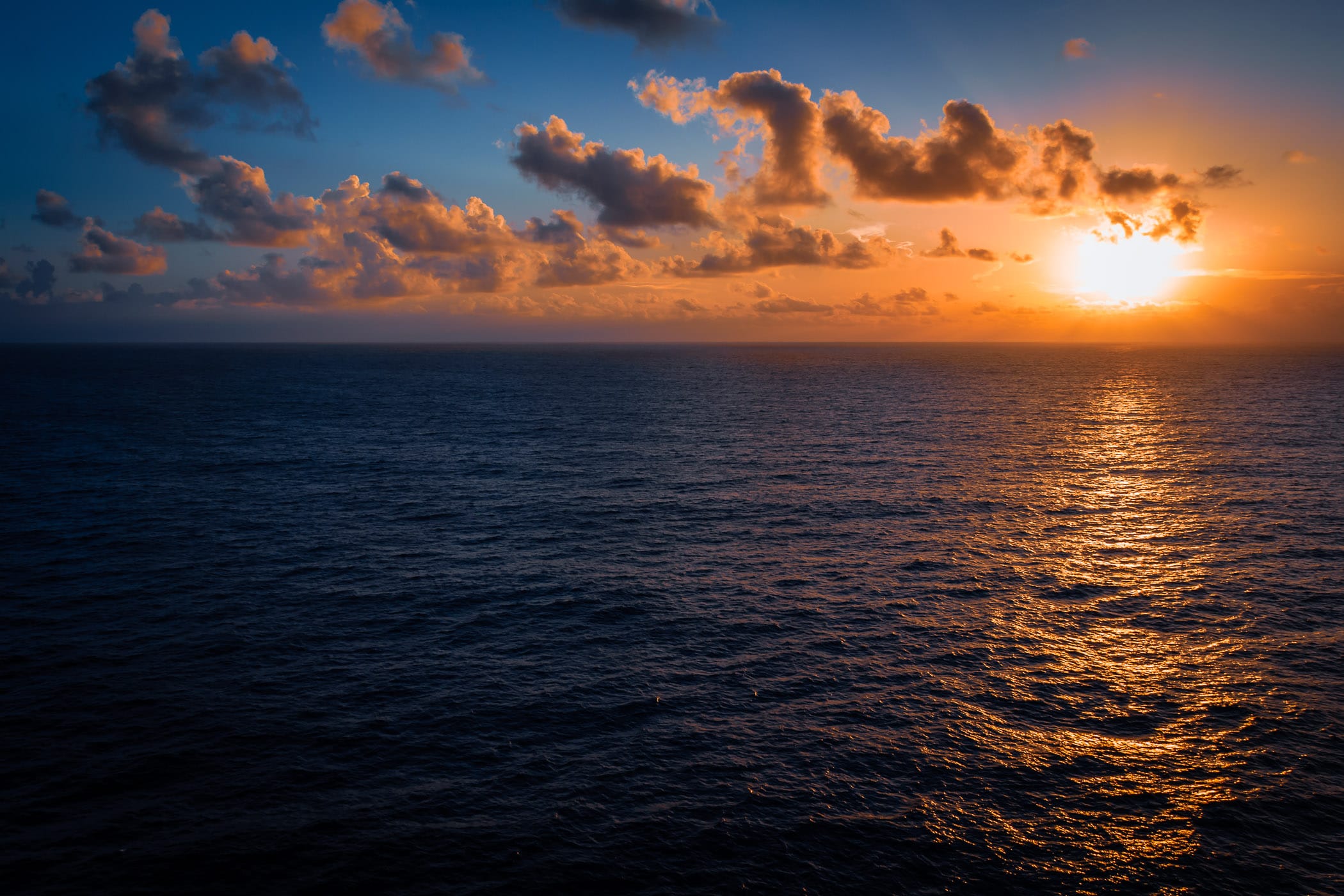 The sun rises over the Gulf of Mexico, as seen from the deck of the cruise ship Carnival Triumph.