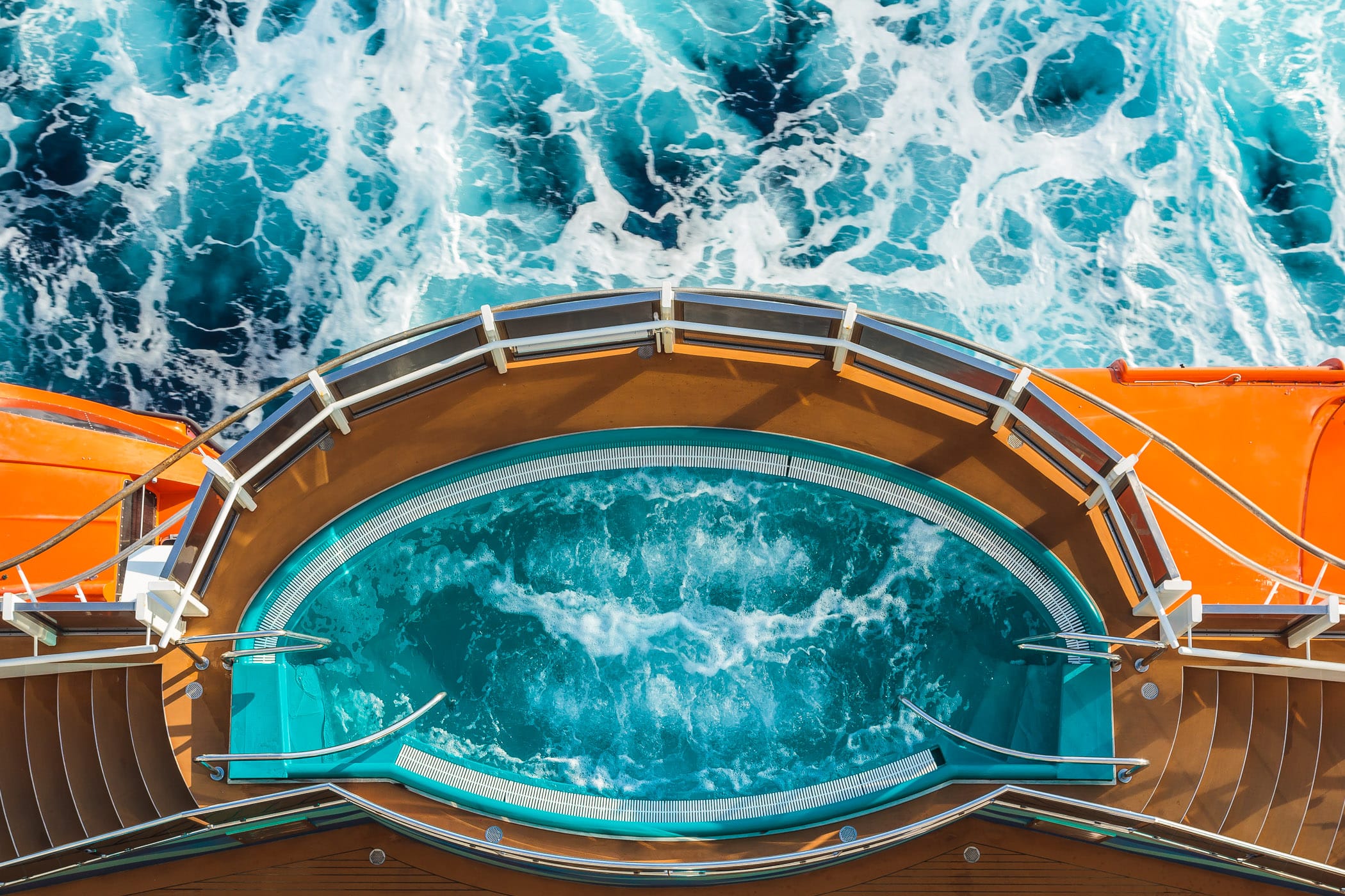 One of the four hot tubs that bulge out over the sea aboard the cruise ship Carnival Magic, as seen from above.