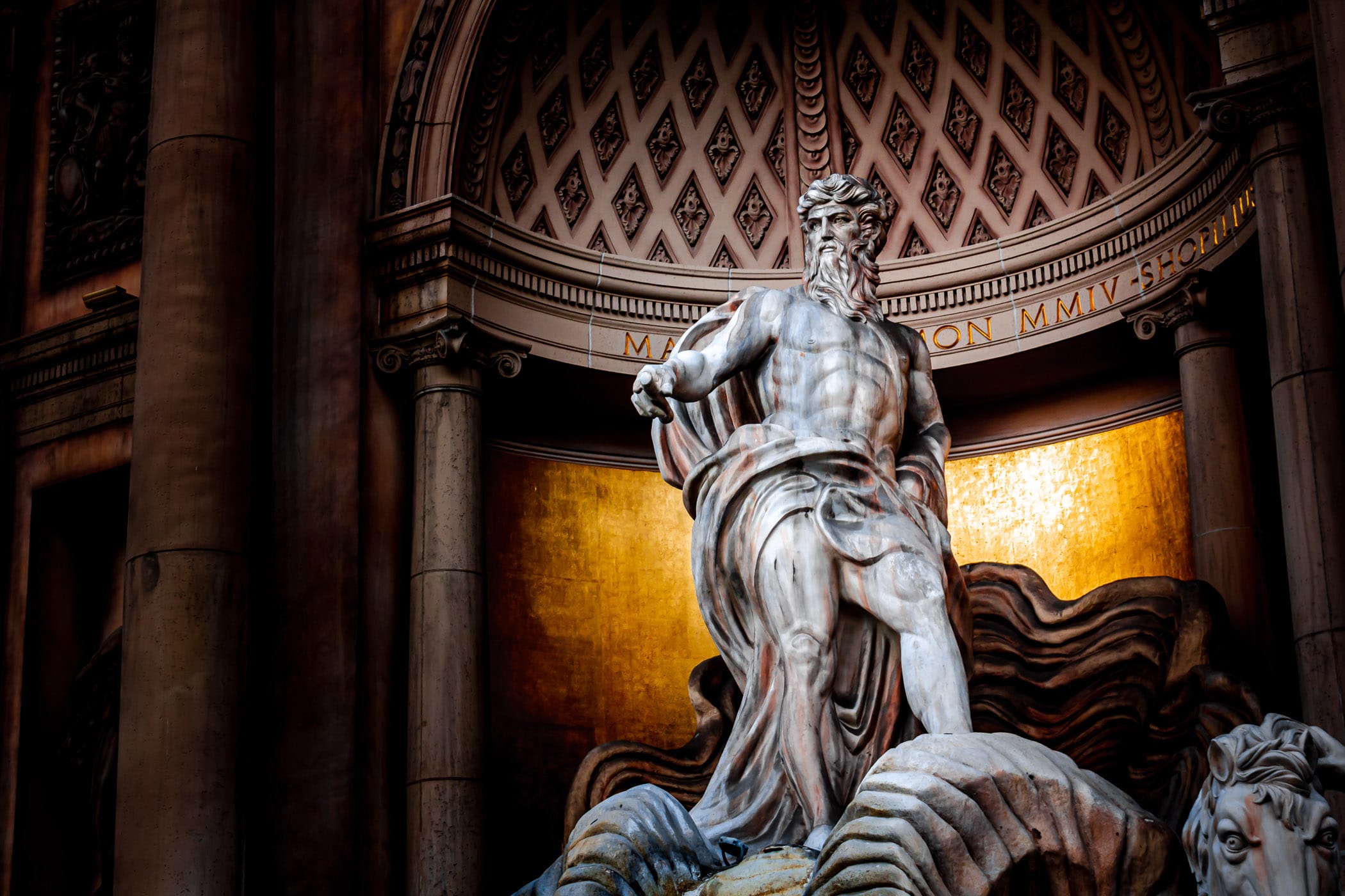 A statue of the Roman god of the sea, Neptune, known as Poseidon to the Greeks, stands in a replica of Rome's Trevi Fountain outside of the Forum Shops at Caesars Palace, Las Vegas.