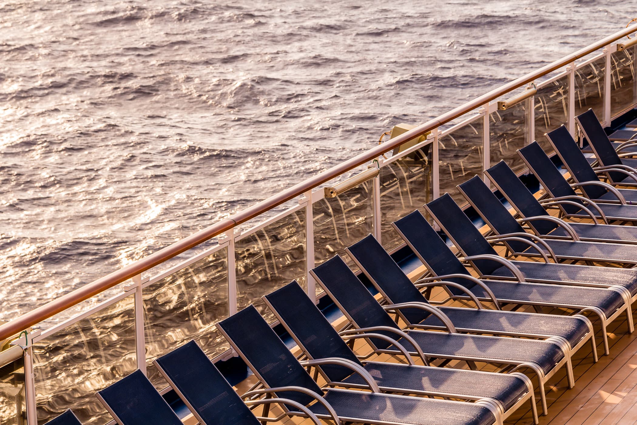Lounge chairs greet the morning sun aboard the cruise ship Carnival Magic, somewhere in the Gulf of Mexico.
