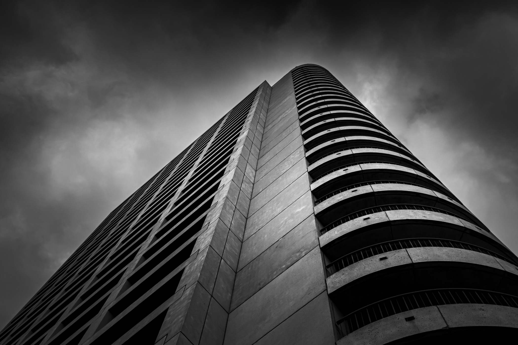 The Omni Mandalay at Las Colinas, in Irving, Texas, seems to reach for the early-morning clouds.