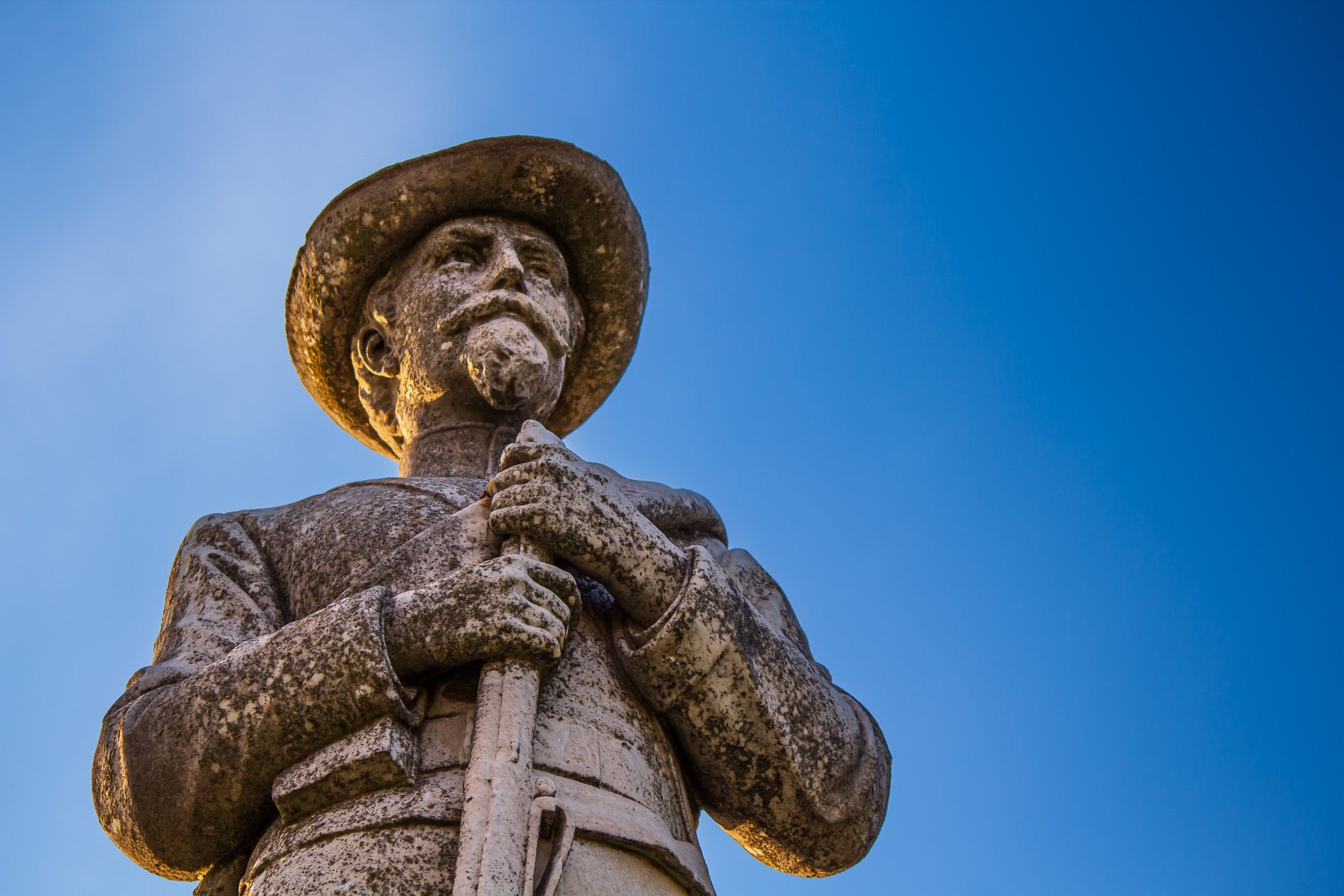 A carved stone Confederate soldier watched over the Confederate Soldiers Monument, Oakwood Cemetery, Tyler, Texas.