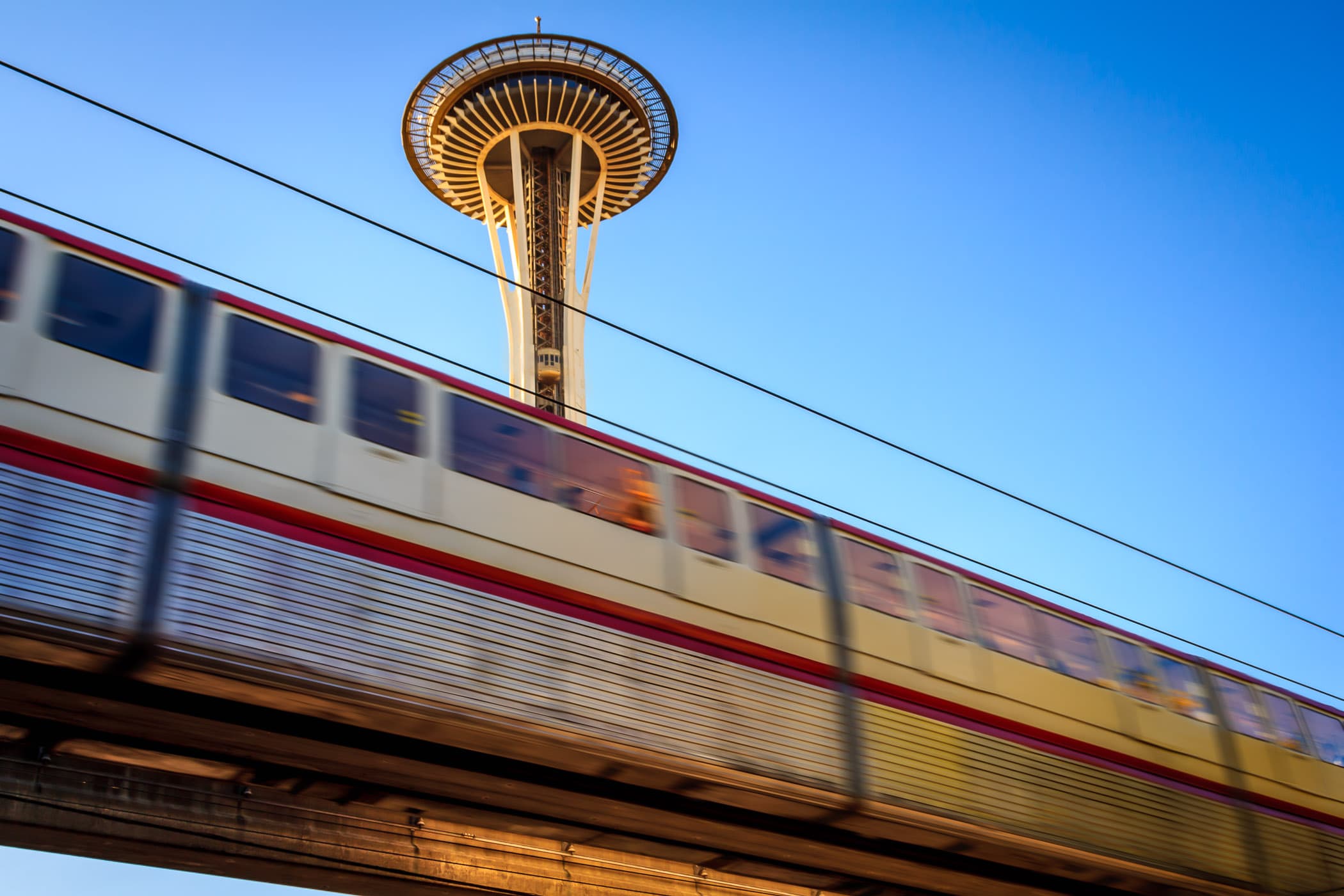 The Seattle Monorail speeds past the Space Needle on its route from the Seattle Center to the Westlake Center.
