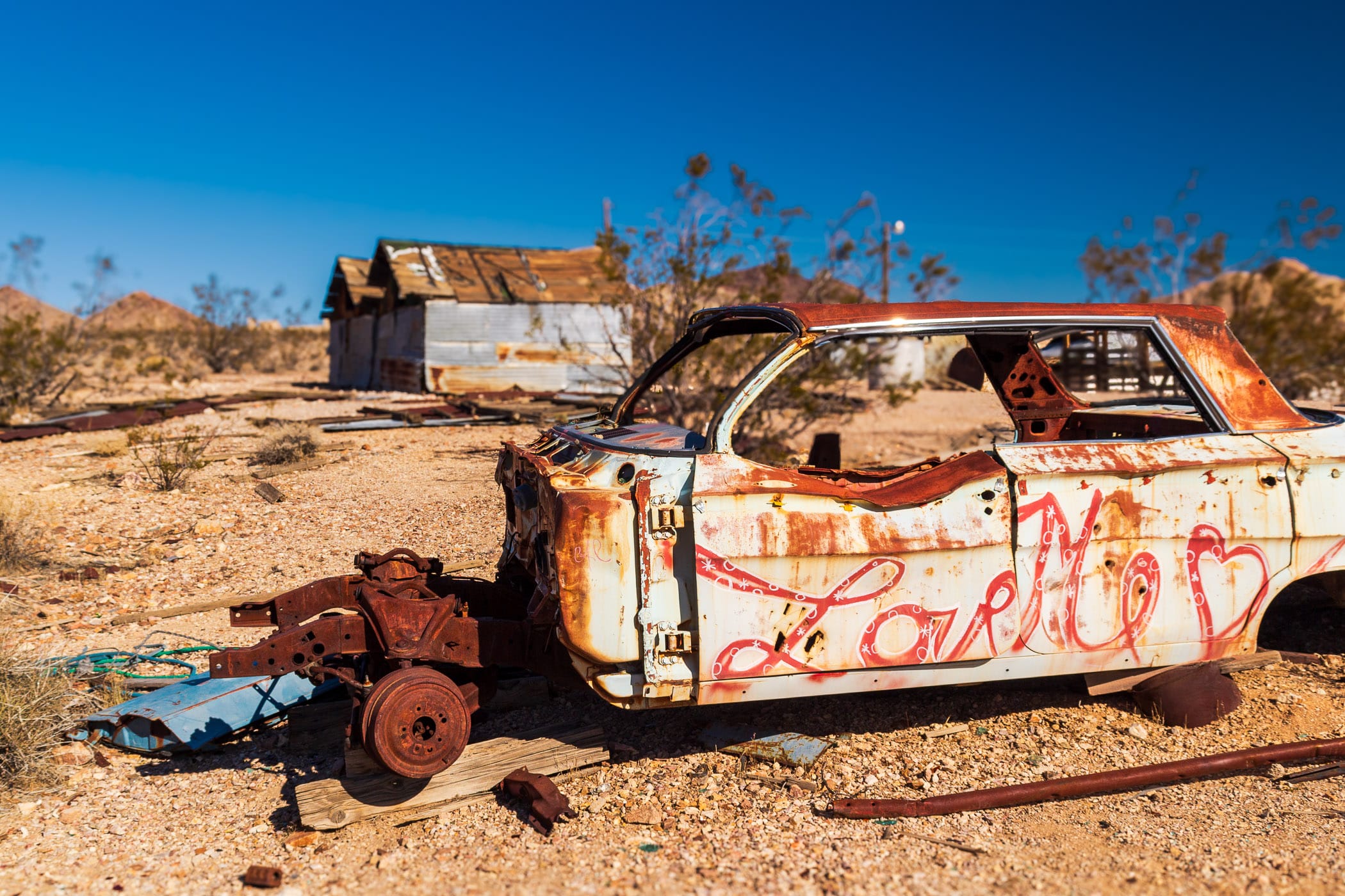 A decidedly un-loved Chevrolet Impala decays in the Nevada desert at the ghost town of Rhyolite.