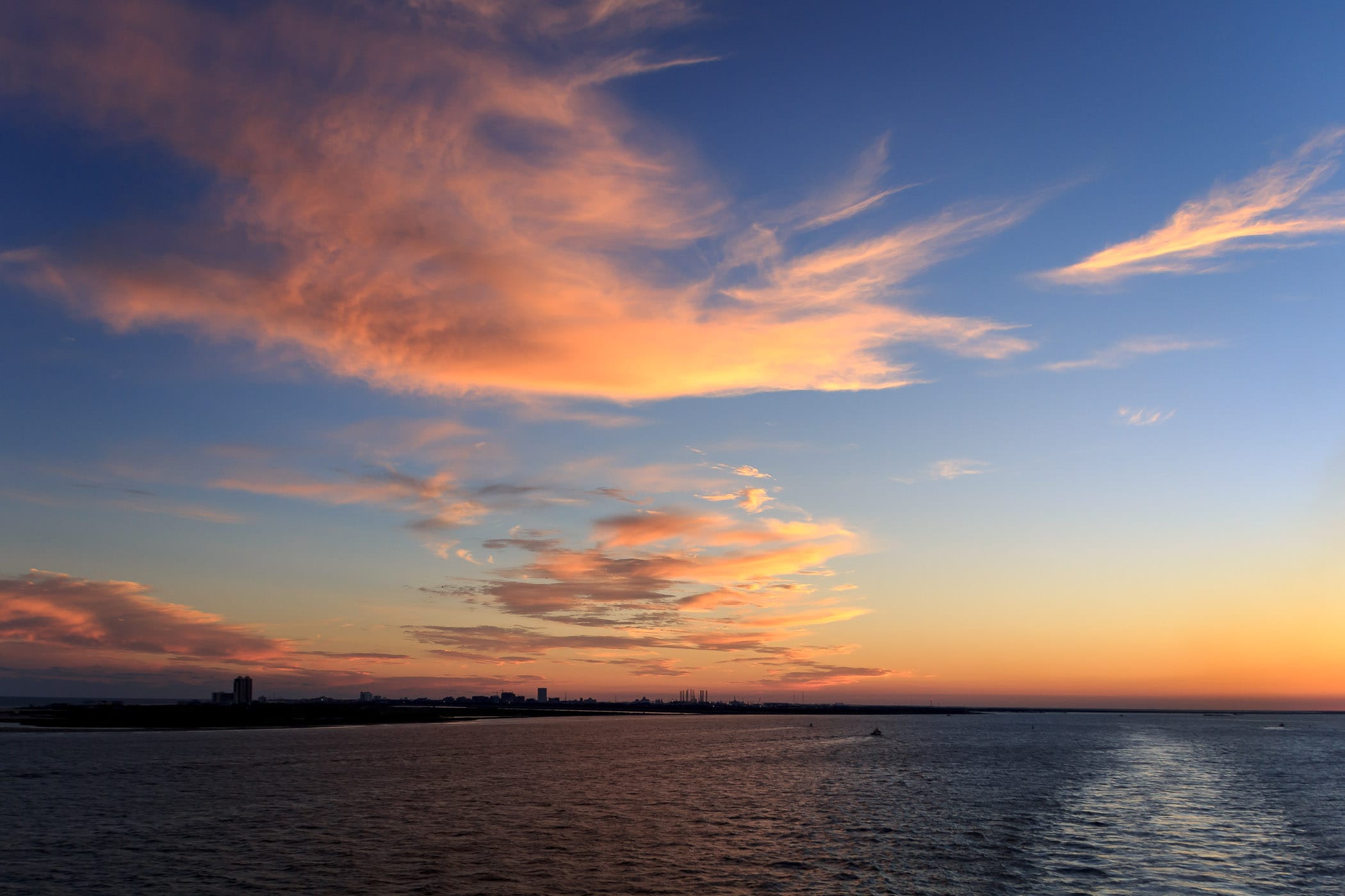 Clouds illuminated by the setting sun over Galveston Bay, Texas.