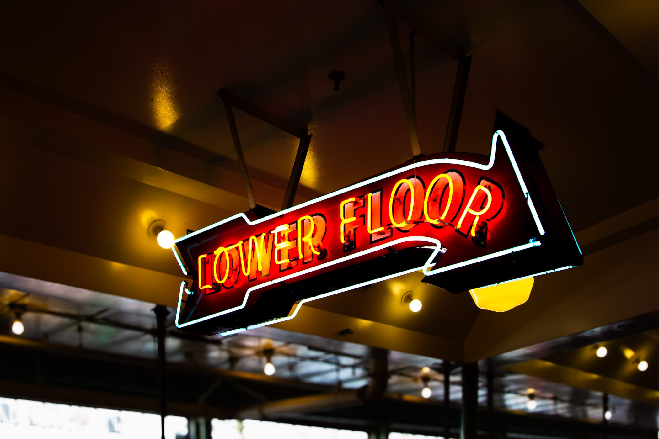A neon sign offers directions at Seattle's Pike Place Market.