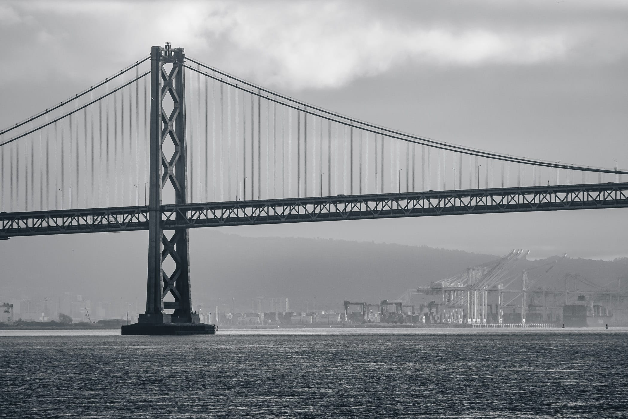 One of the towers of the San Francisco-Oakland Bay Bridge rises above San Francisco Bay.