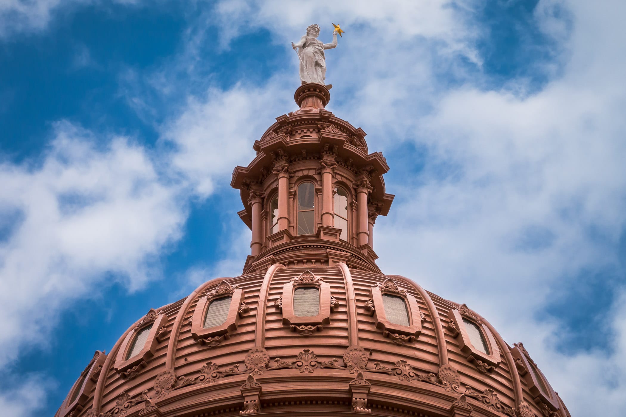 The Goddess of Liberty statue atop the 308-foot-tall dome of the Texas State Capitol, Austin.