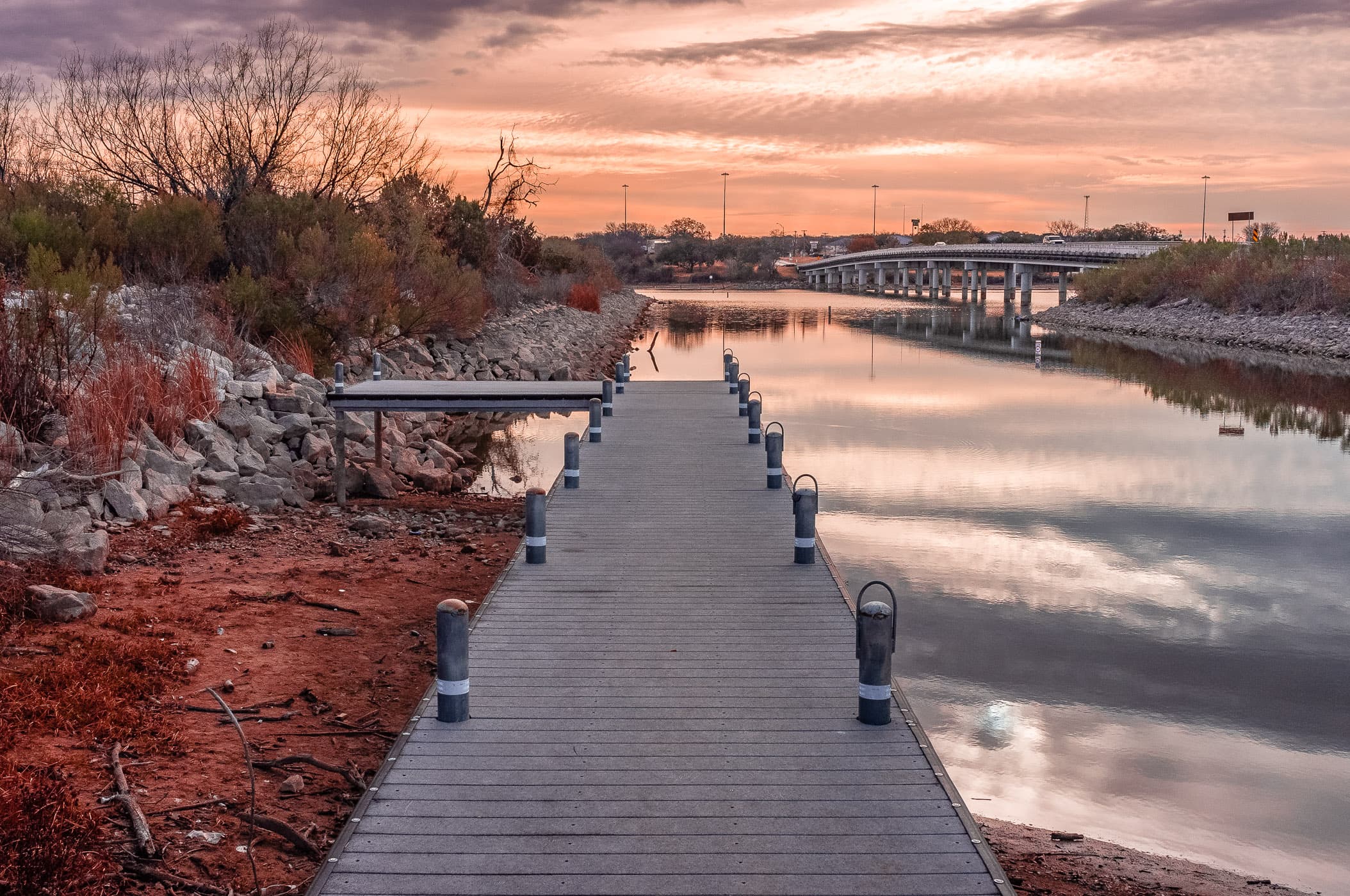A pier—made almost useless by low water levels—greets the morning sun at Lake Granbury, Texas.