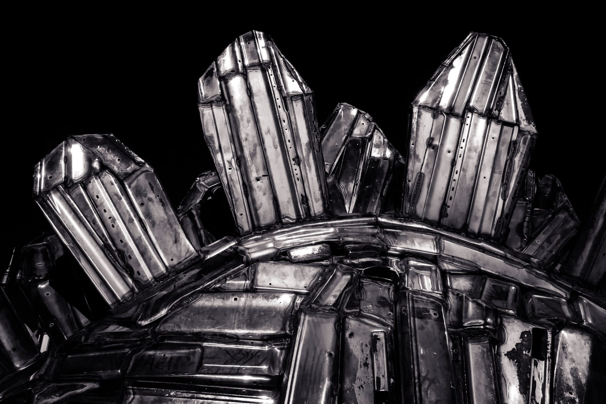 Detail of a sculpture of a chrome stegosaurus by artist John Kearney on display at Louis Tussaud's Palace of Wax in Grand Prairie, Texas.