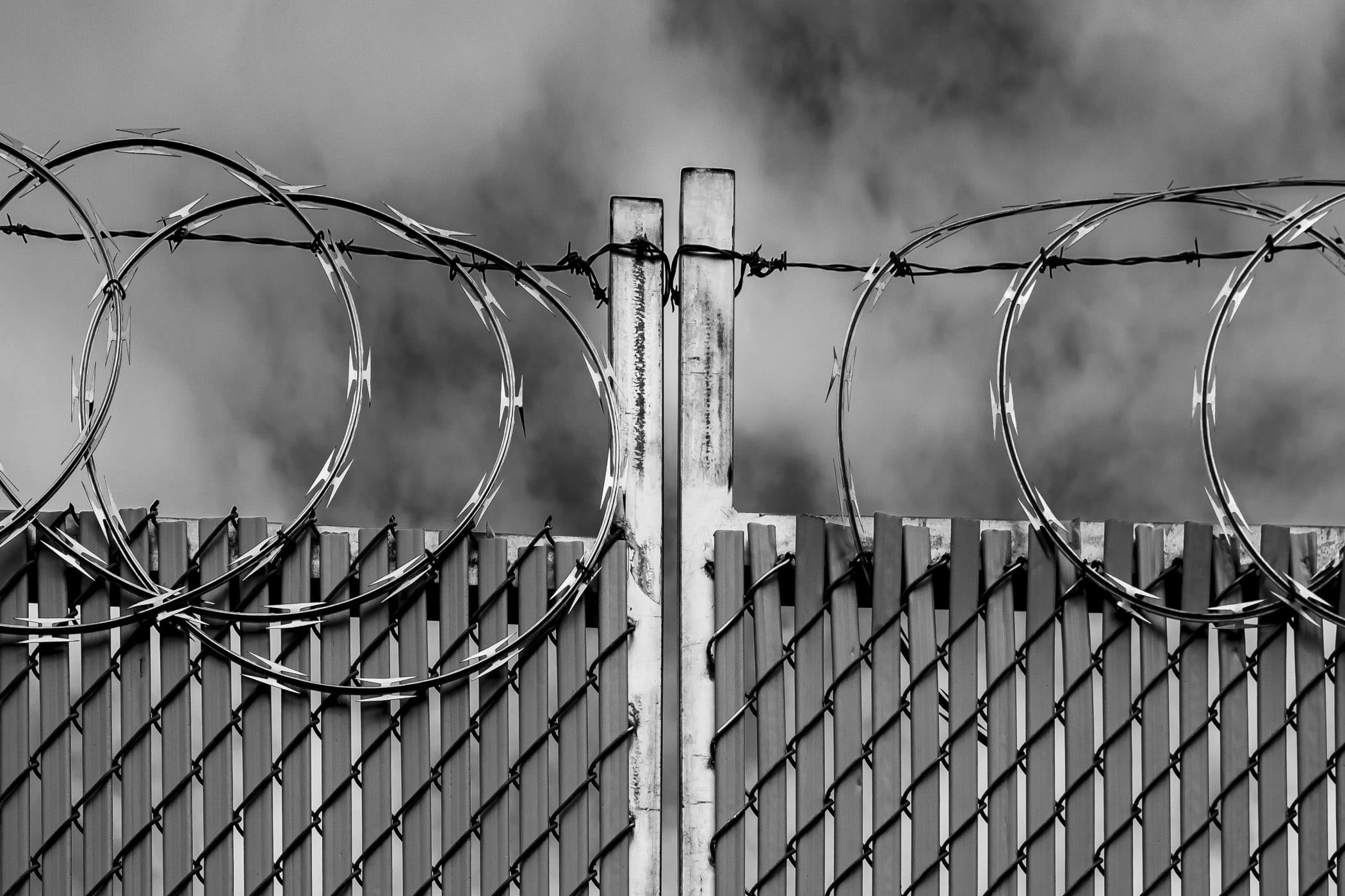 Coils of concertina wire top a fence in Dallas' Deep Ellum neighborhood.