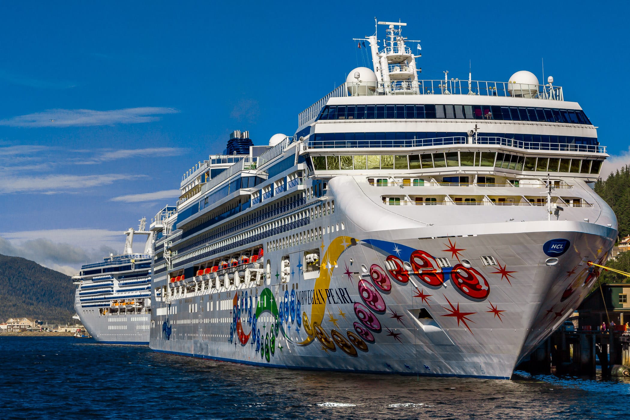 The cruise ships Norwegian Pearl and Coral Princess, docked at the cruise ship pier in Ketchikan, Alaska.