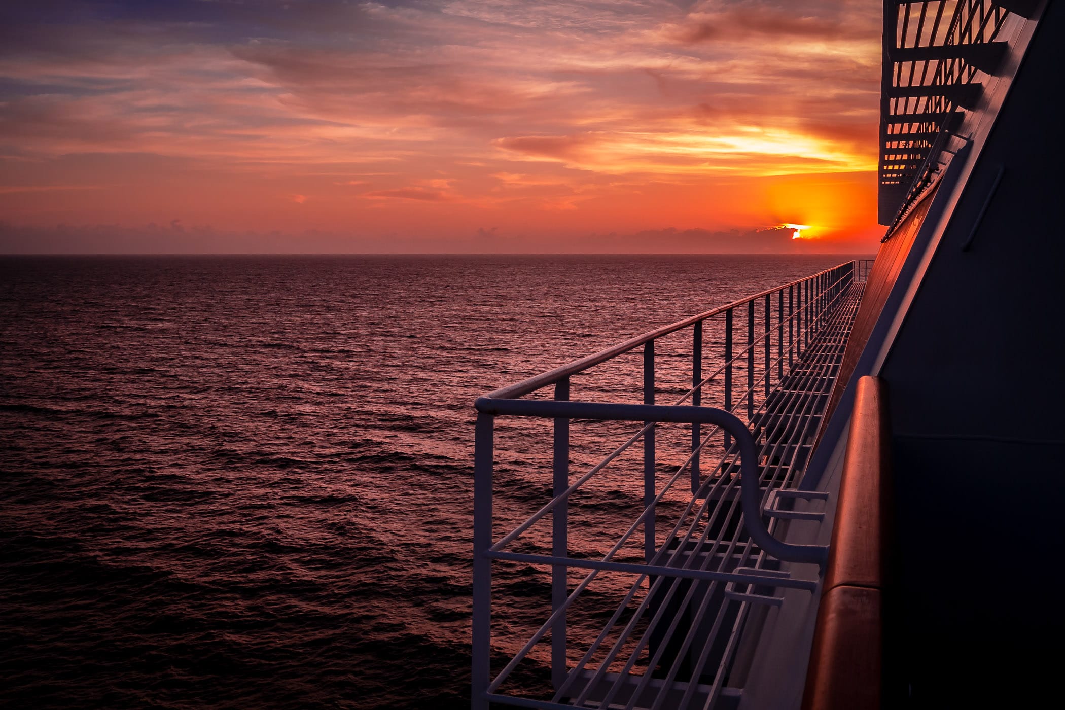 The sun rises over the Straits of Florida as seen from the cruise ship Carnival Magic.